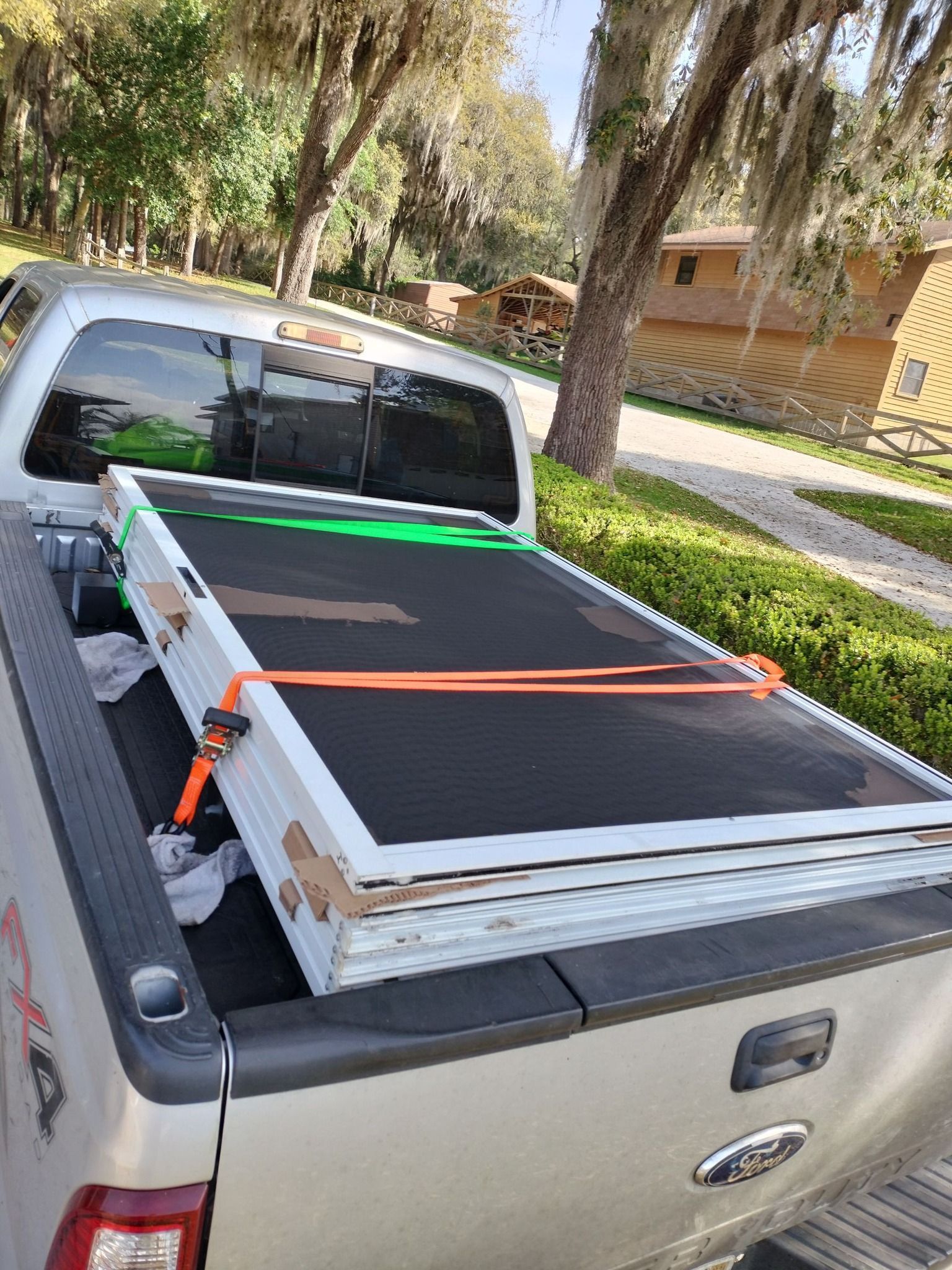 The back of a pickup truck with a ramp in the bed.