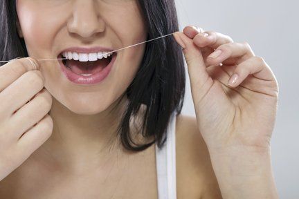 woman cleaning teeth