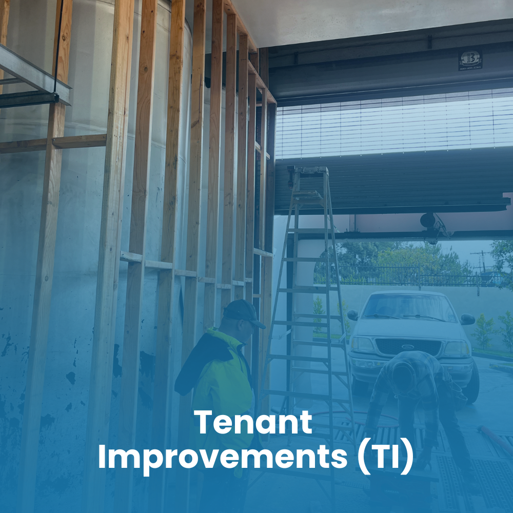 A person on a ladder repairs a hole in a garage ceiling, surrounded by tools and construction materials.