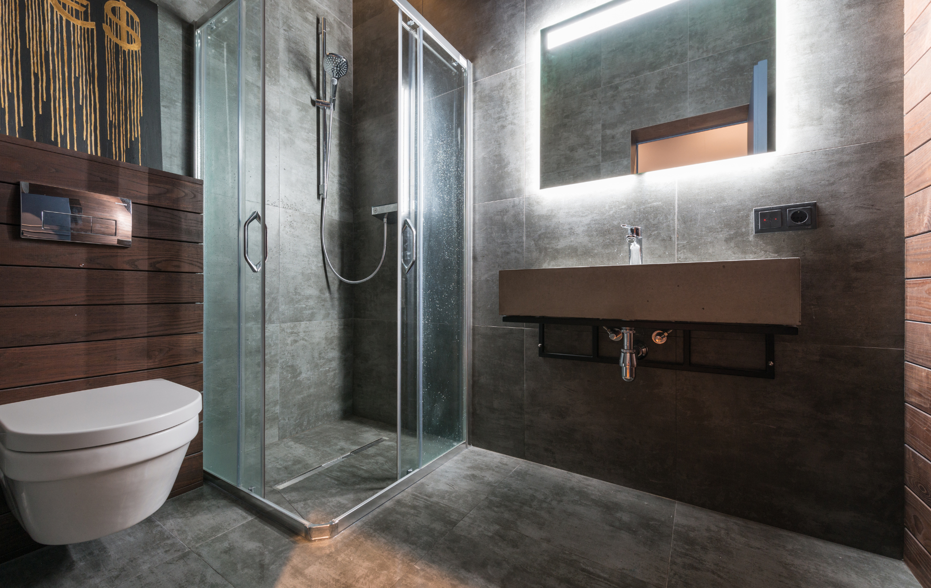 A bathroom with a toilet , sink , shower and mirror.