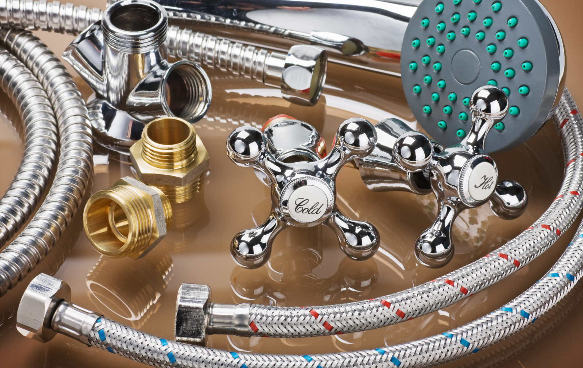 A close up of a shower head and hose on a table