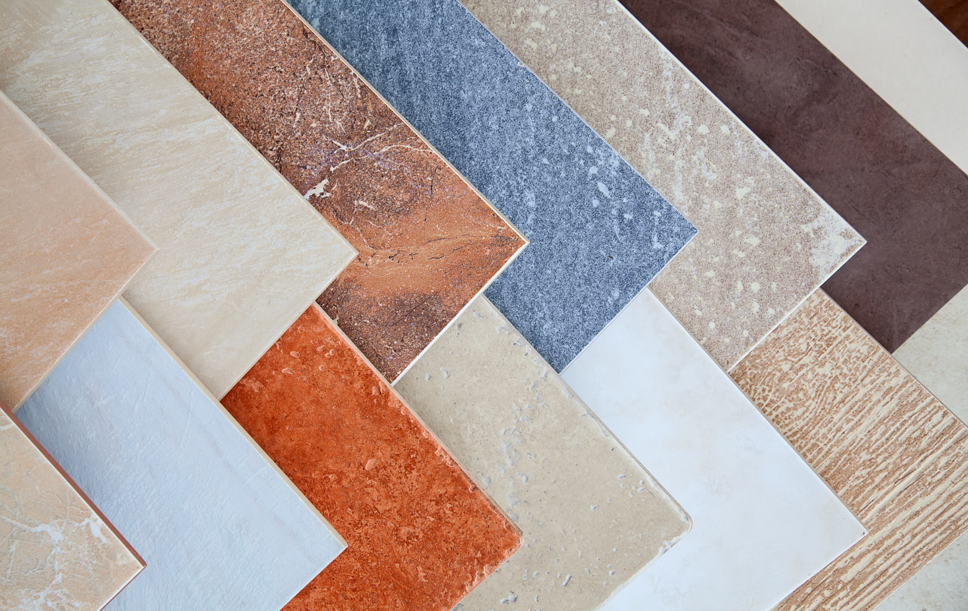 A variety of different colored tiles are lined up in a row.