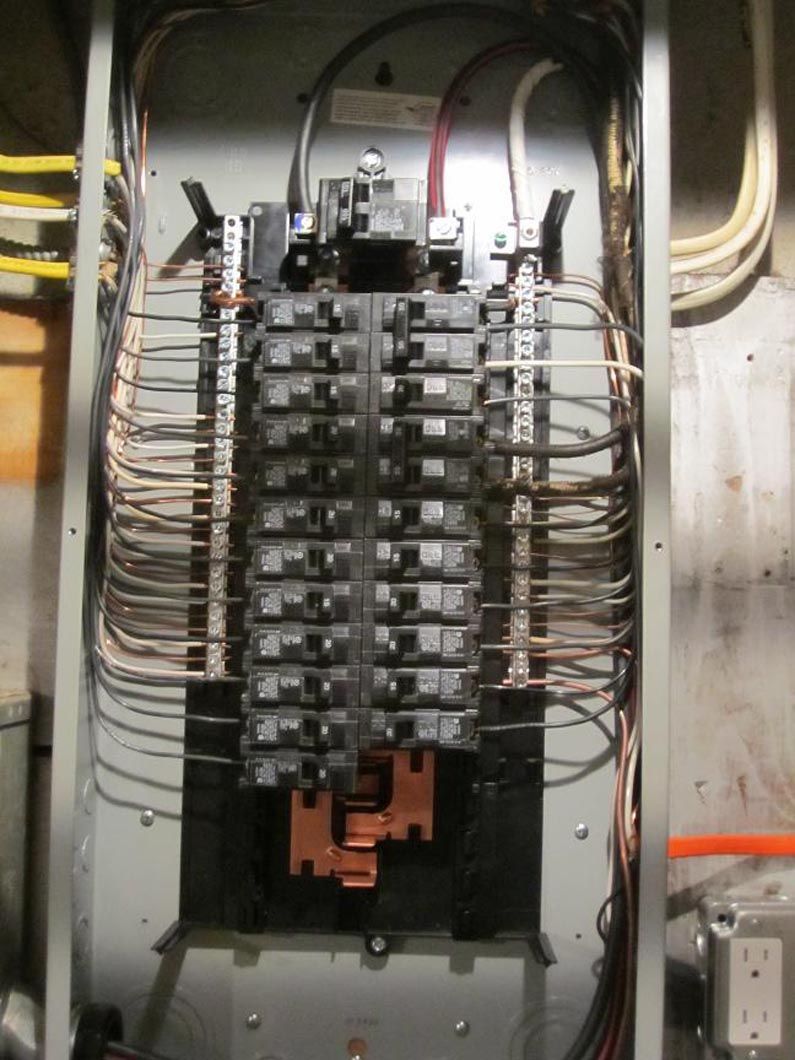 A electrical box with a lot of wires coming out of it