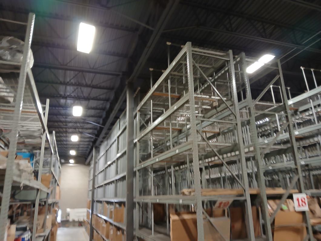 A large warehouse filled with lots of shelves and boxes.