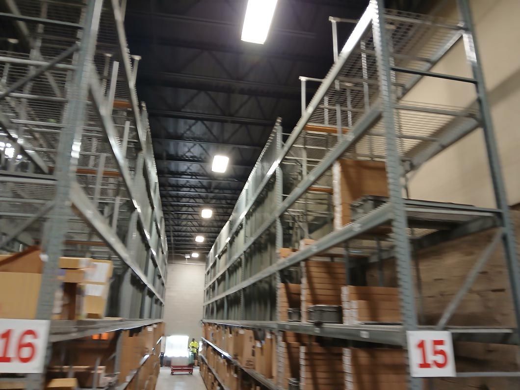 A warehouse with shelves numbered 16 15 and 16