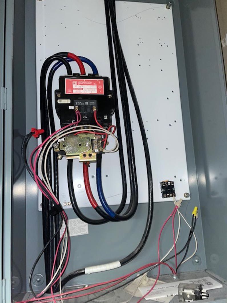 A box with a lot of wires coming out of it