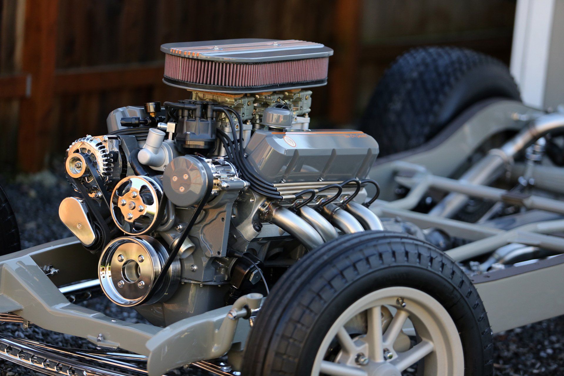 A close up of a car engine on a chassis