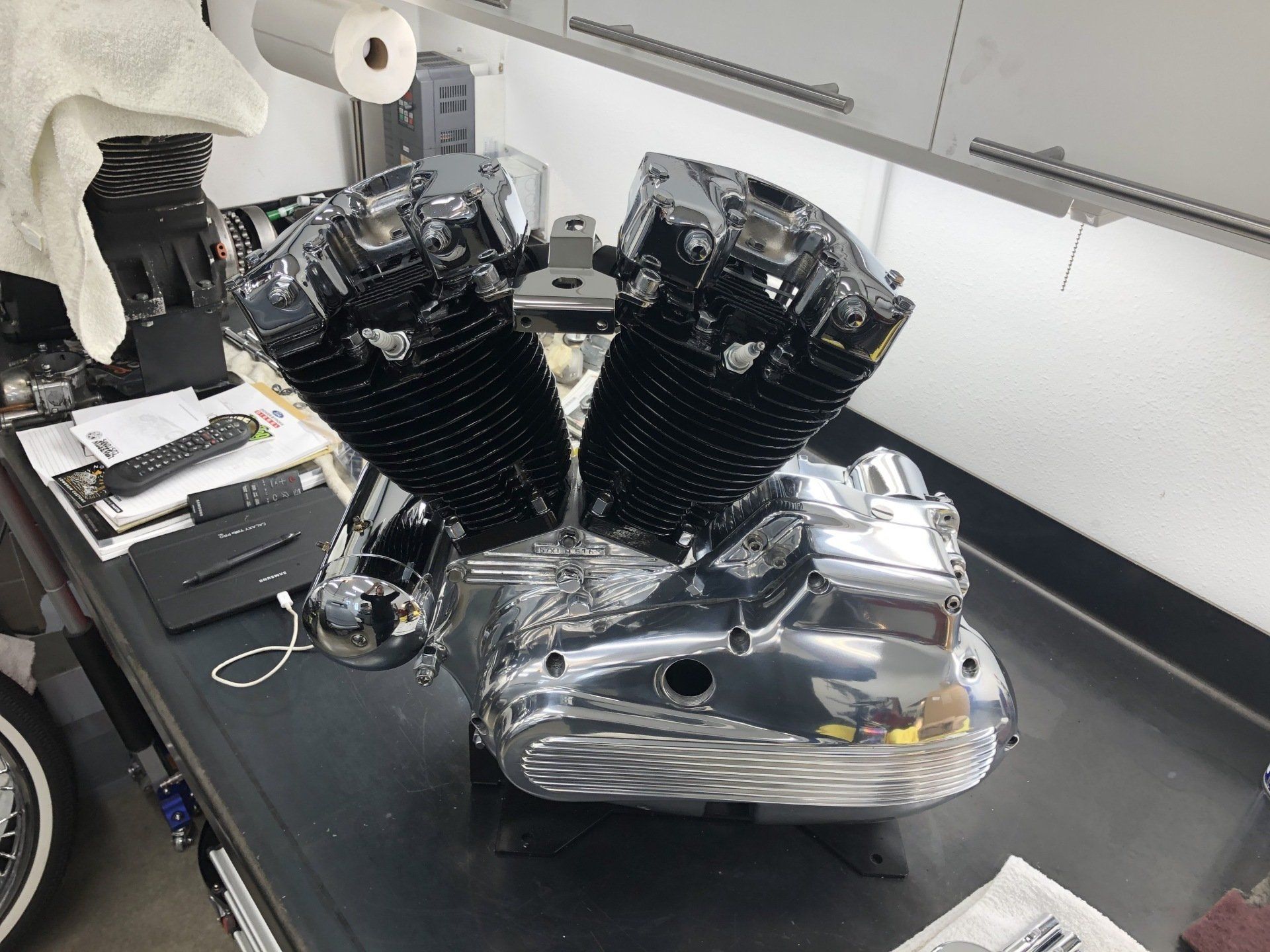 A close up of a motorcycle engine on a table