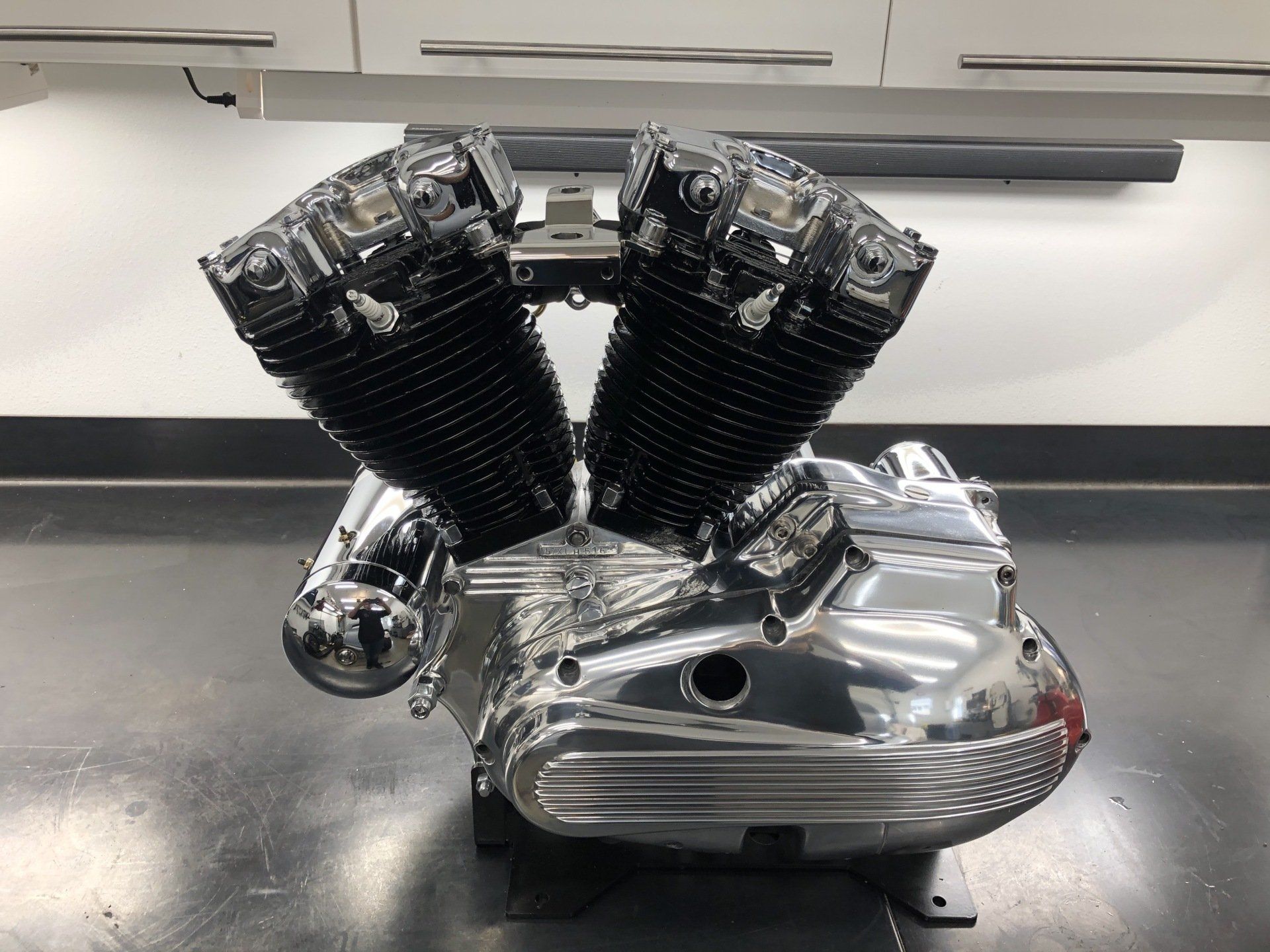 A motorcycle engine is sitting on a black table