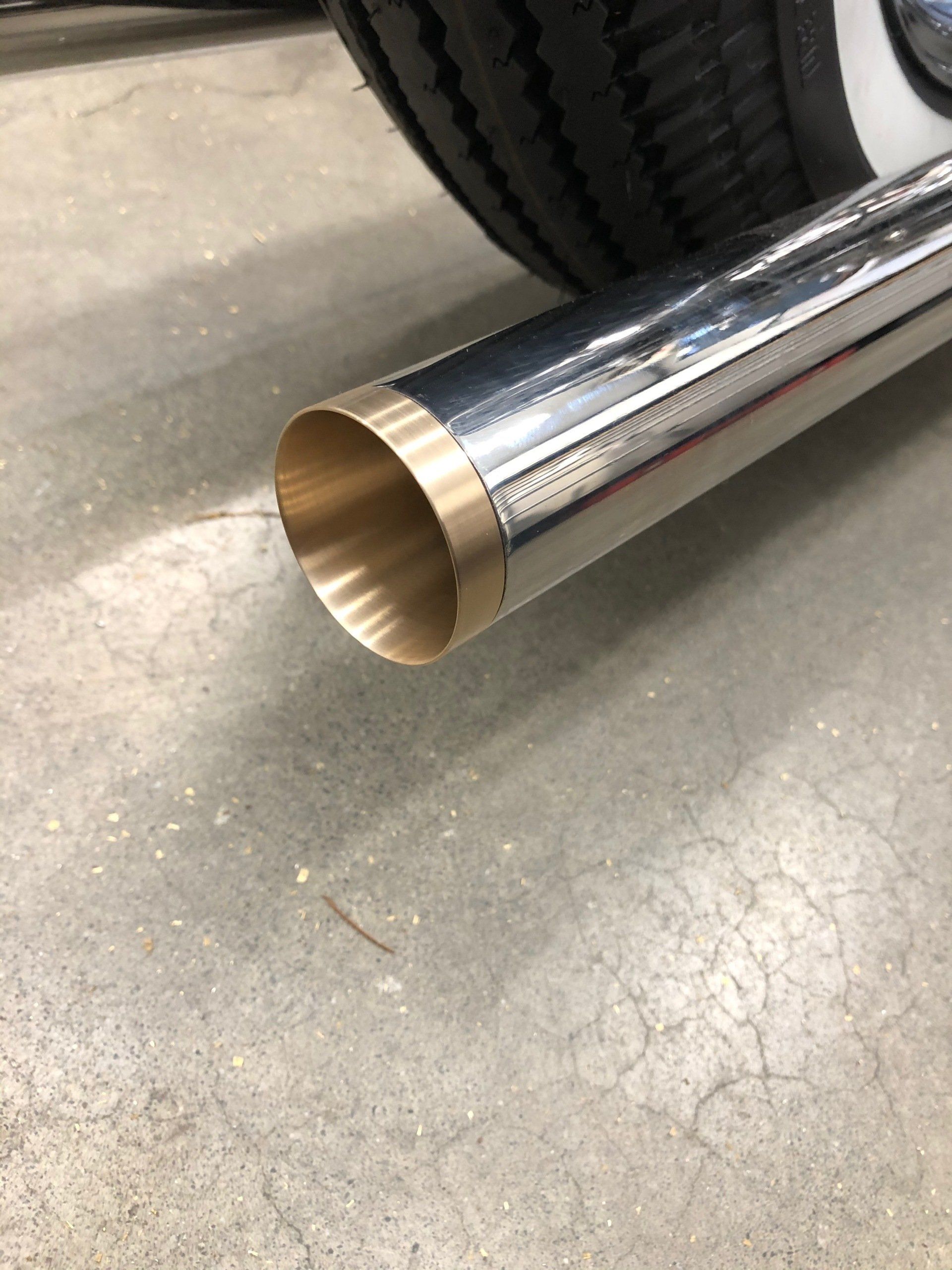 A close up of a exhaust pipe on a motorcycle.