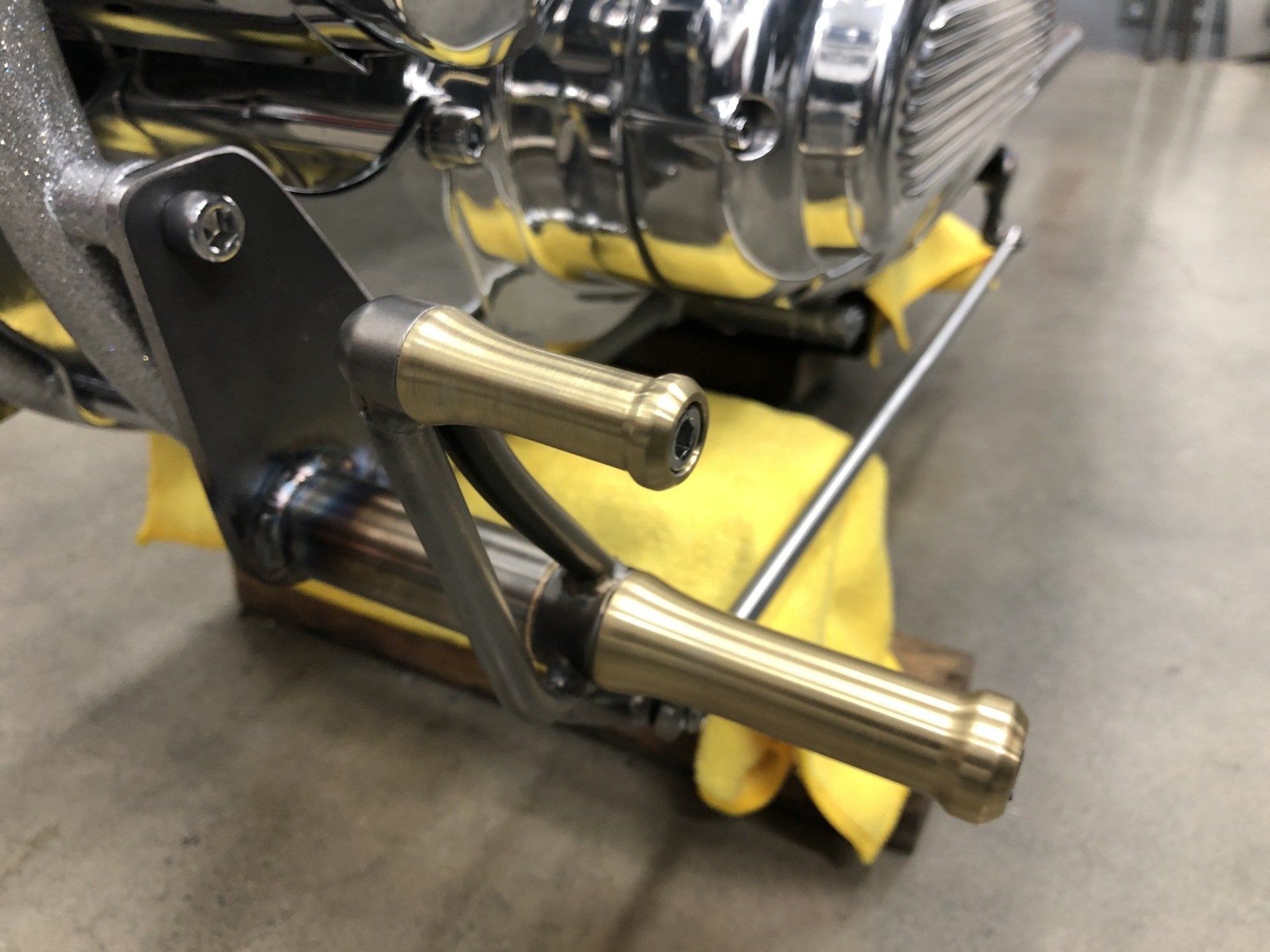 A motorcycle engine is sitting on a yellow cloth
