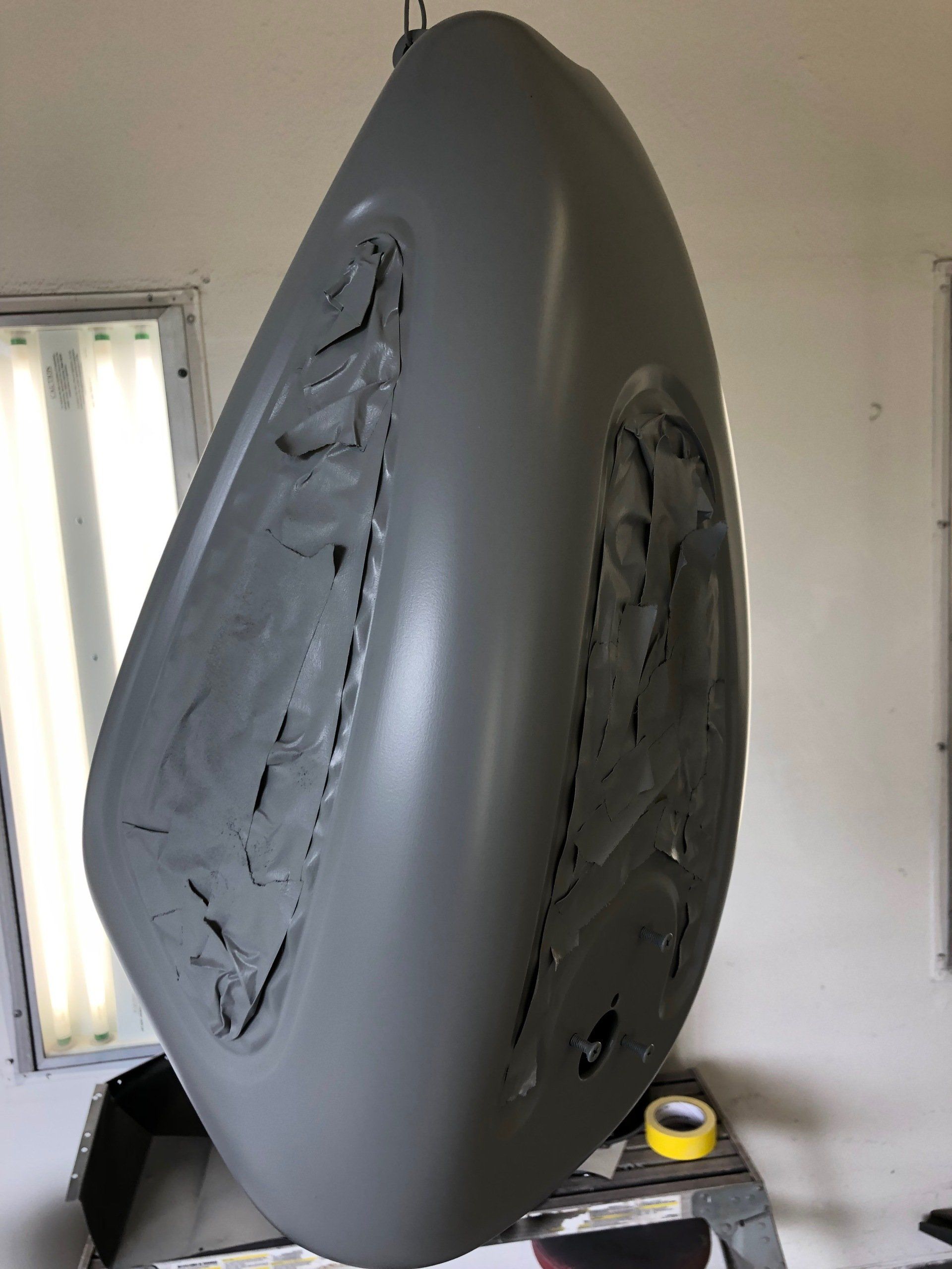 A large gray object is sitting on top of a table in a room.