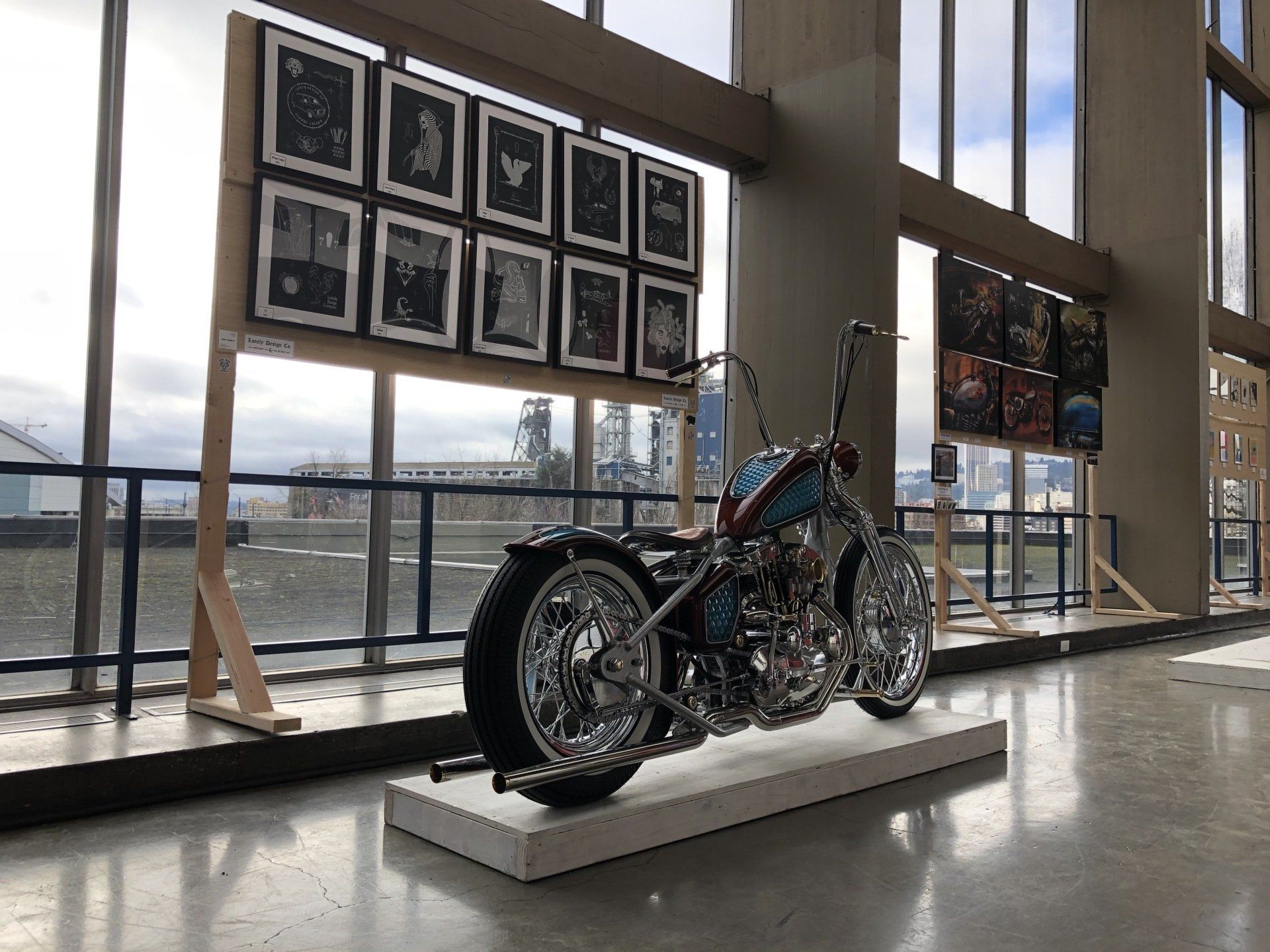 A motorcycle is on display in a large room