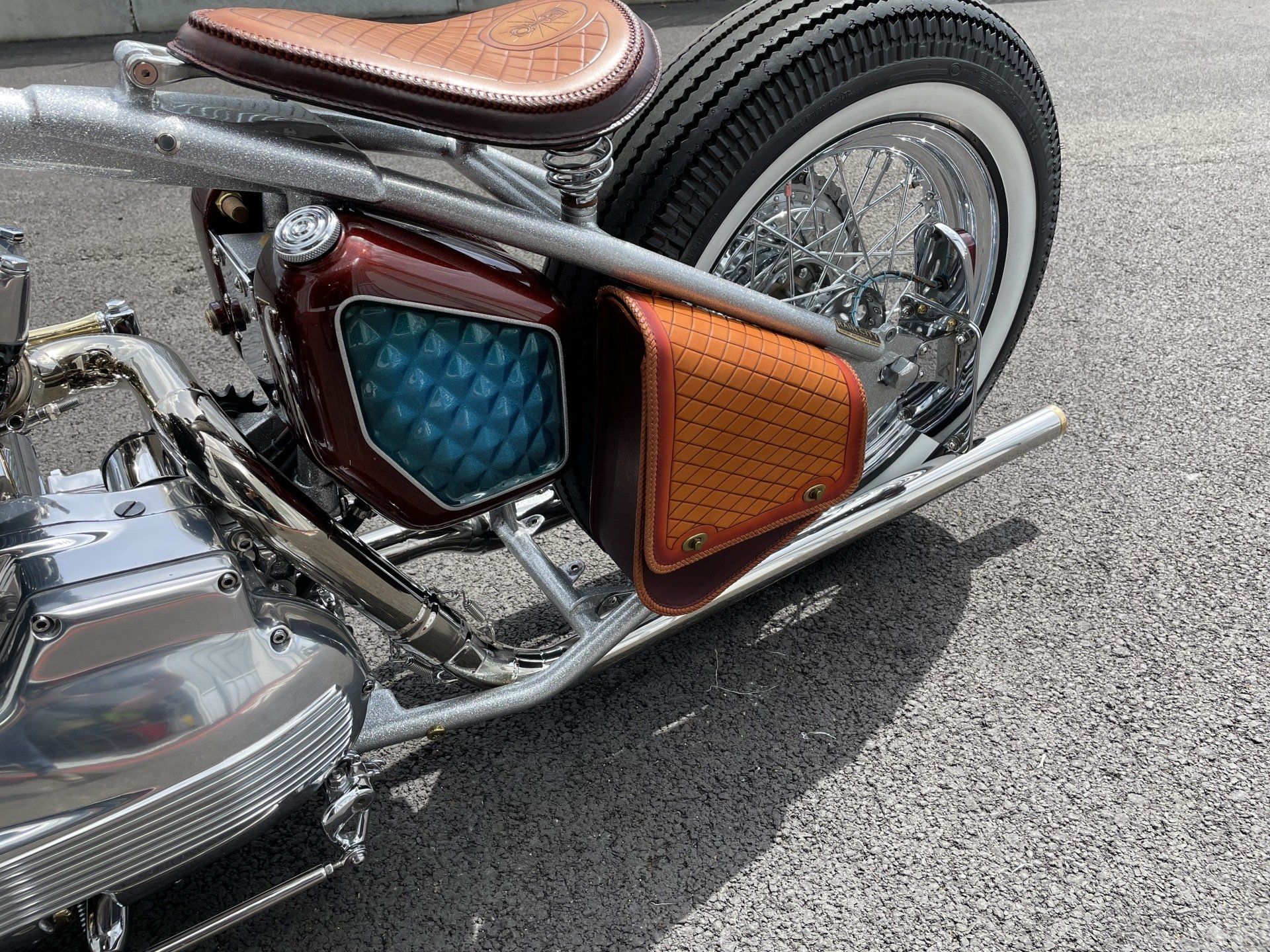 A motorcycle is parked on the side of the road.