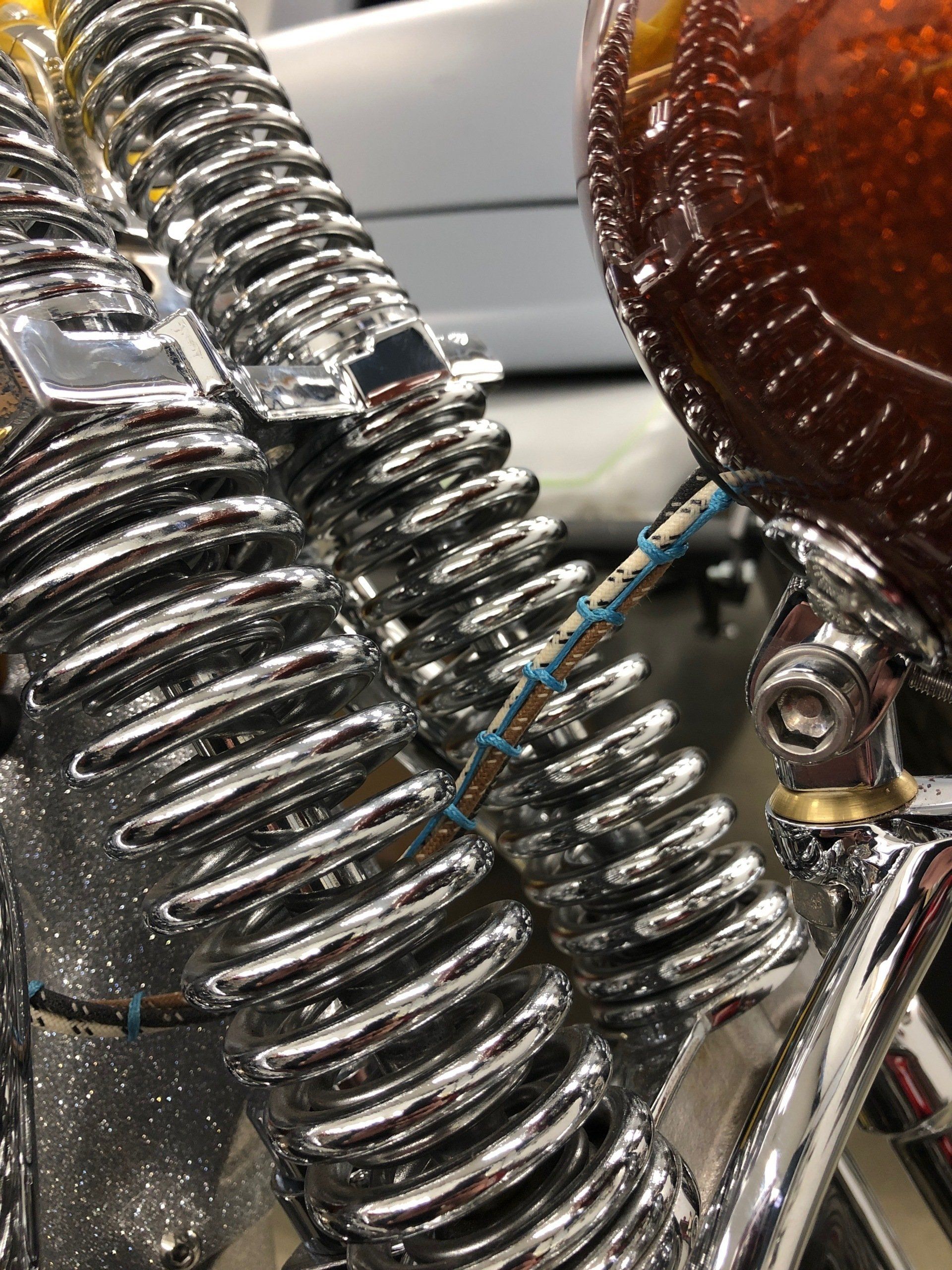 A close up of a motorcycle spring on a motorcycle.