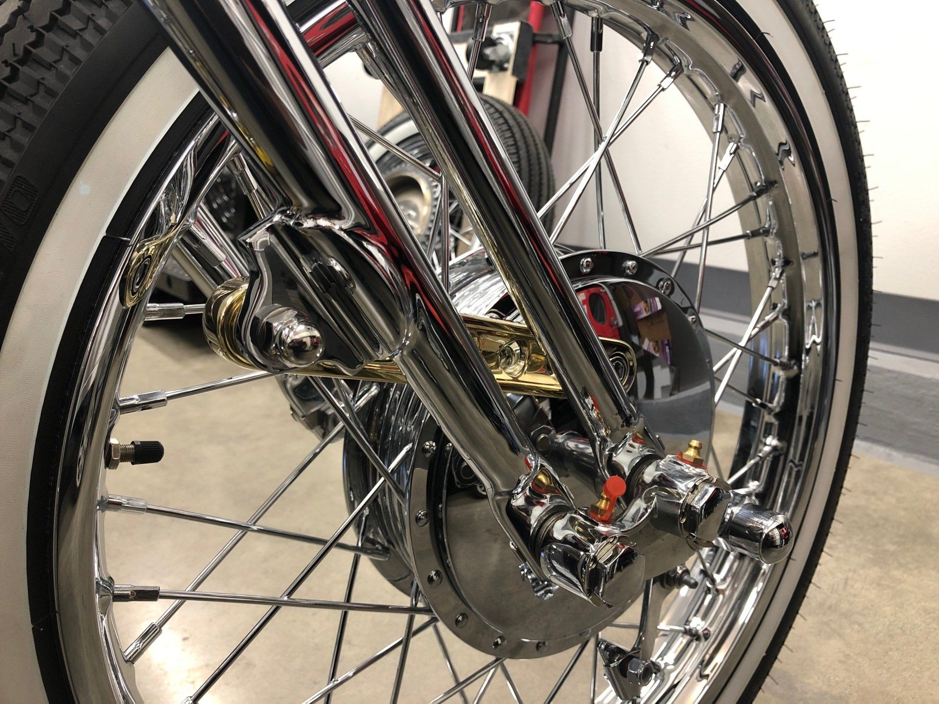 A close up of the front wheel of a motorcycle
