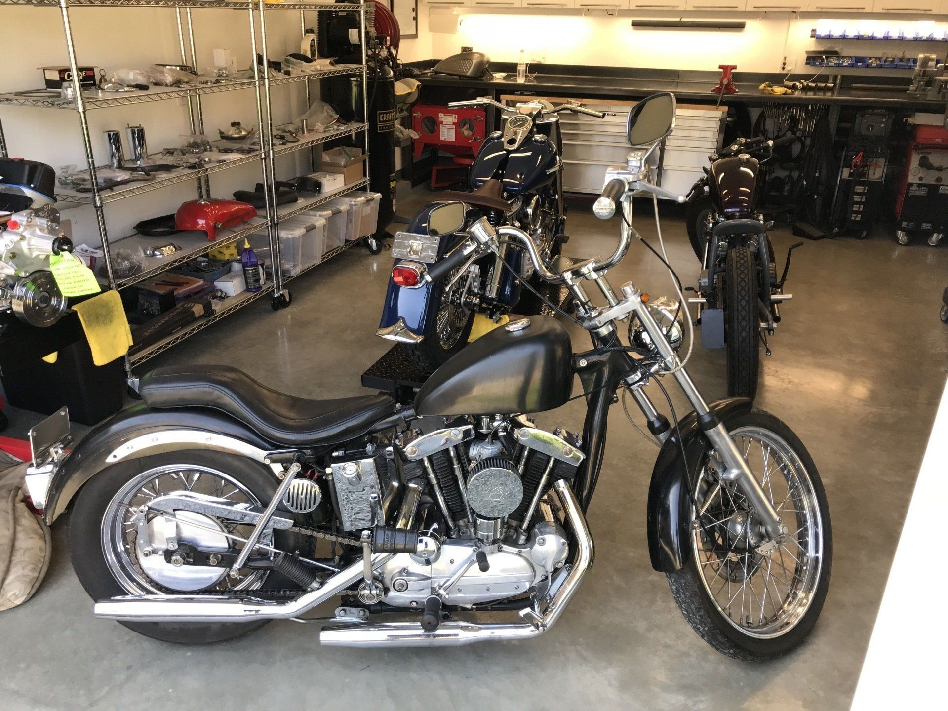 A harley davidson motorcycle is parked in a garage