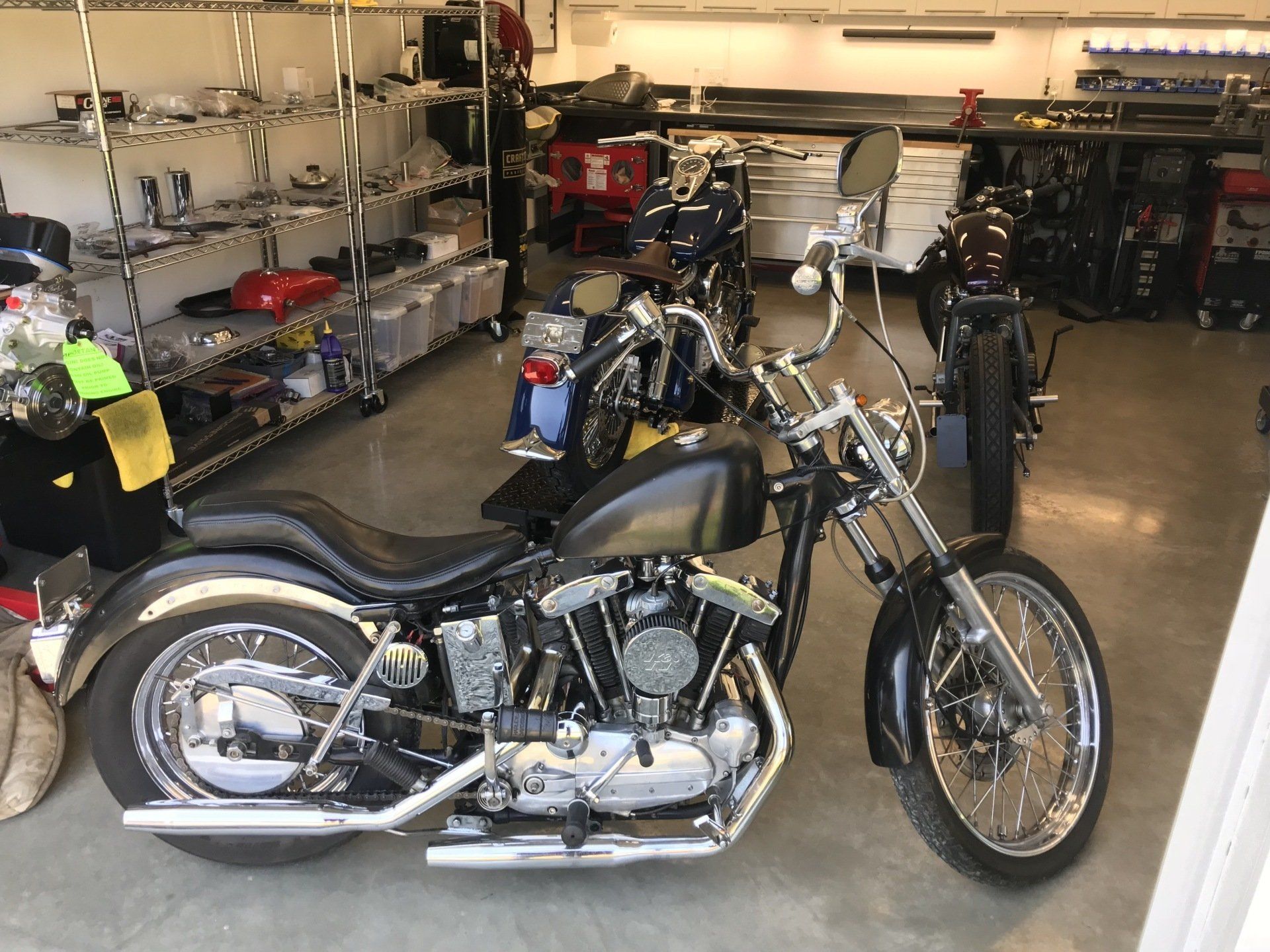 A harley davidson motorcycle is parked in a garage
