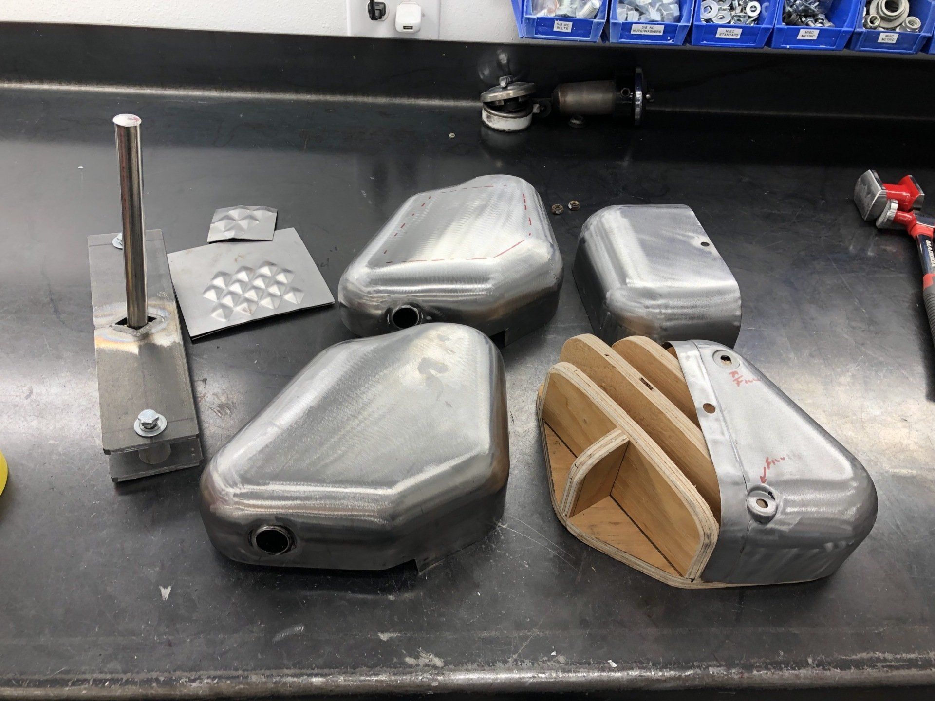 A bunch of metal pieces are sitting on a table.