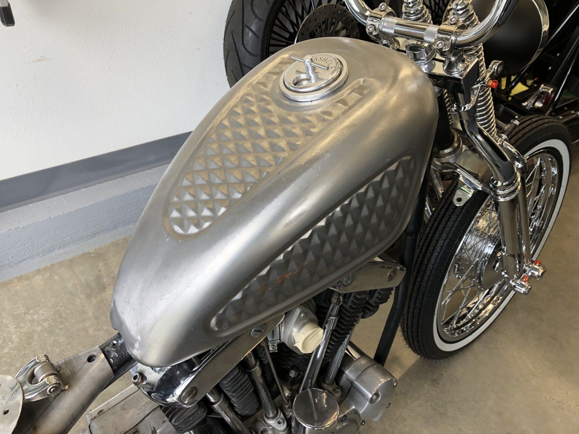 A close up of a motorcycle with a silver tank