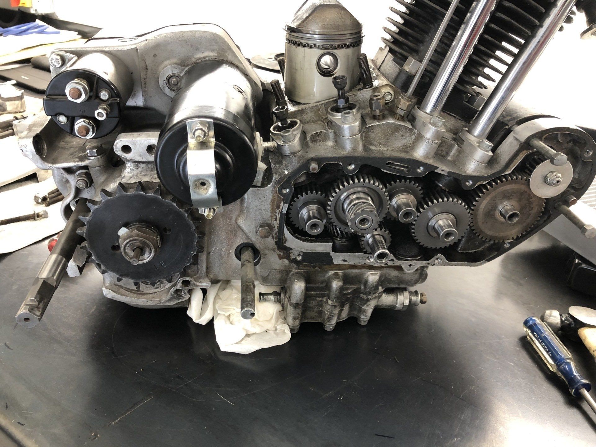 A close up of a motorcycle engine on a table.