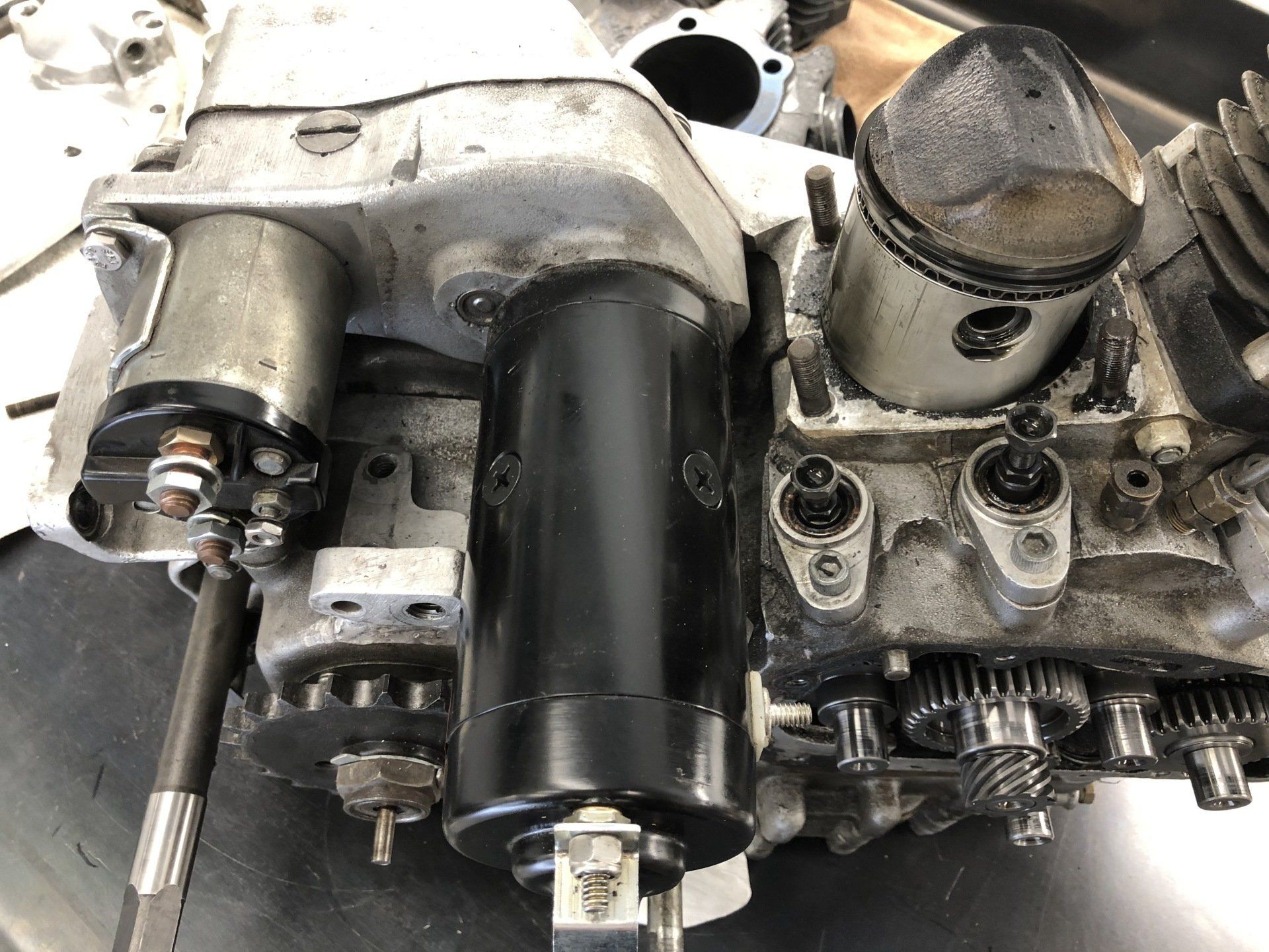 A close up of a motorcycle engine with pistons and gears