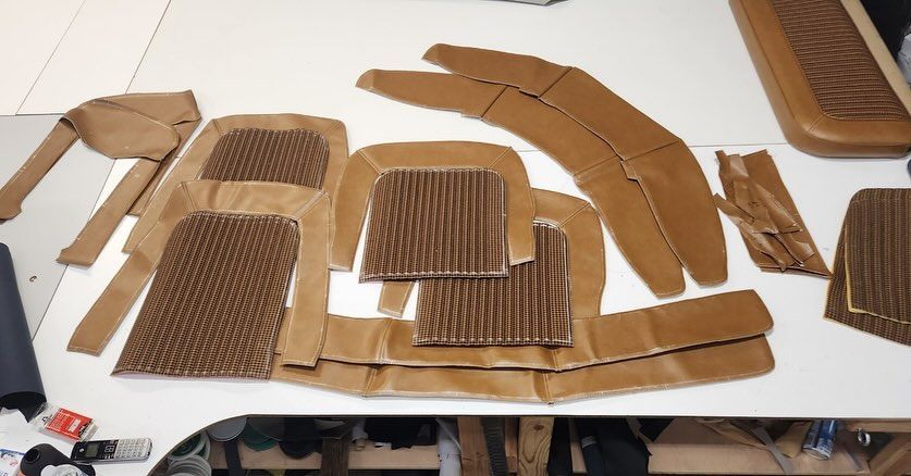 A table with a lot of cardboard pieces on it