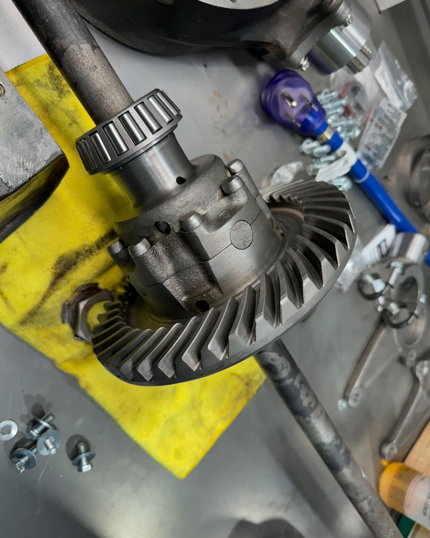 A close up of a gear on a yellow cloth