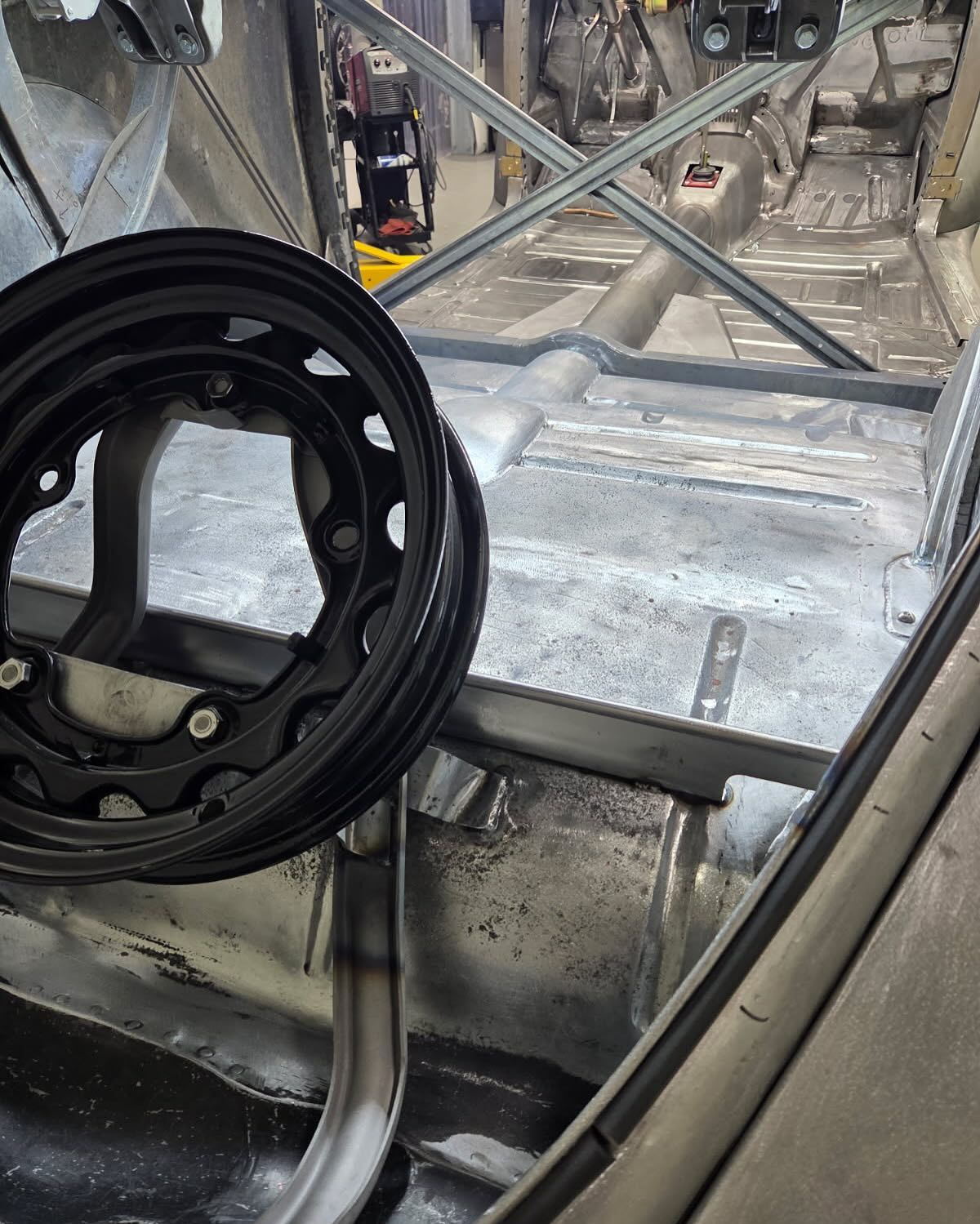 A close up of a wheel in a car