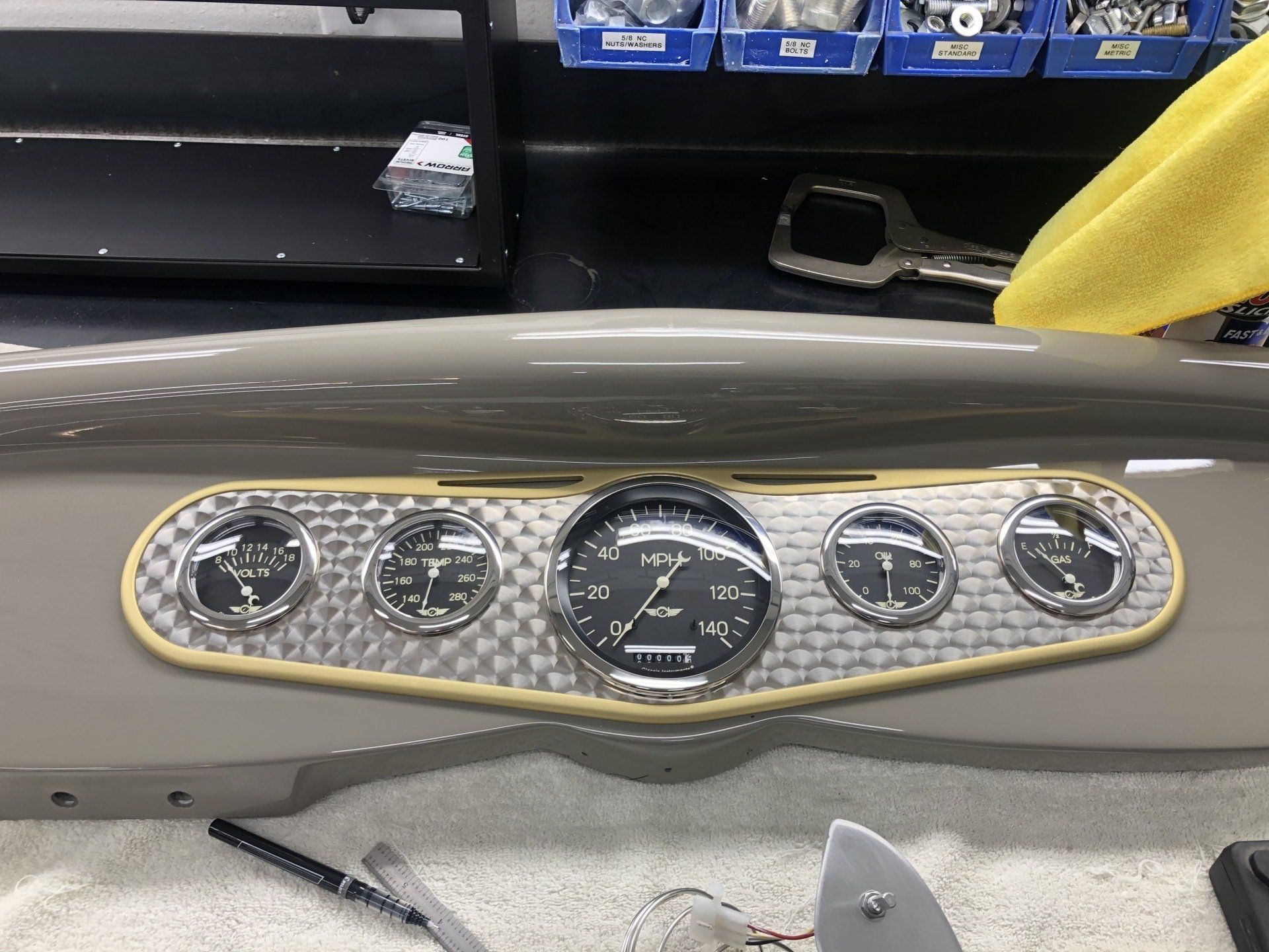 A dashboard of a car with a clock on it