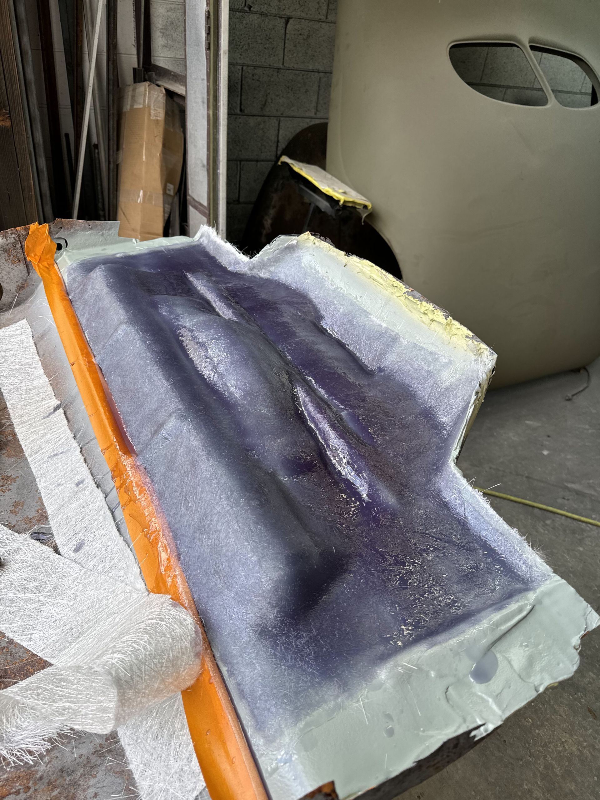 A piece of purple plastic is sitting on a table.