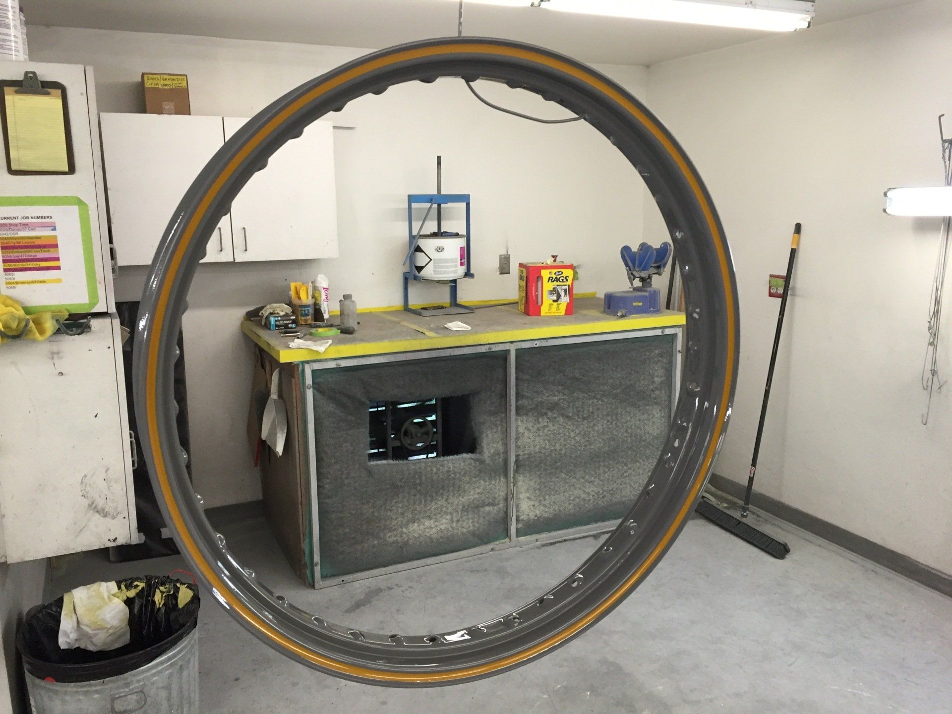 A large circular object is hanging from the ceiling in a room