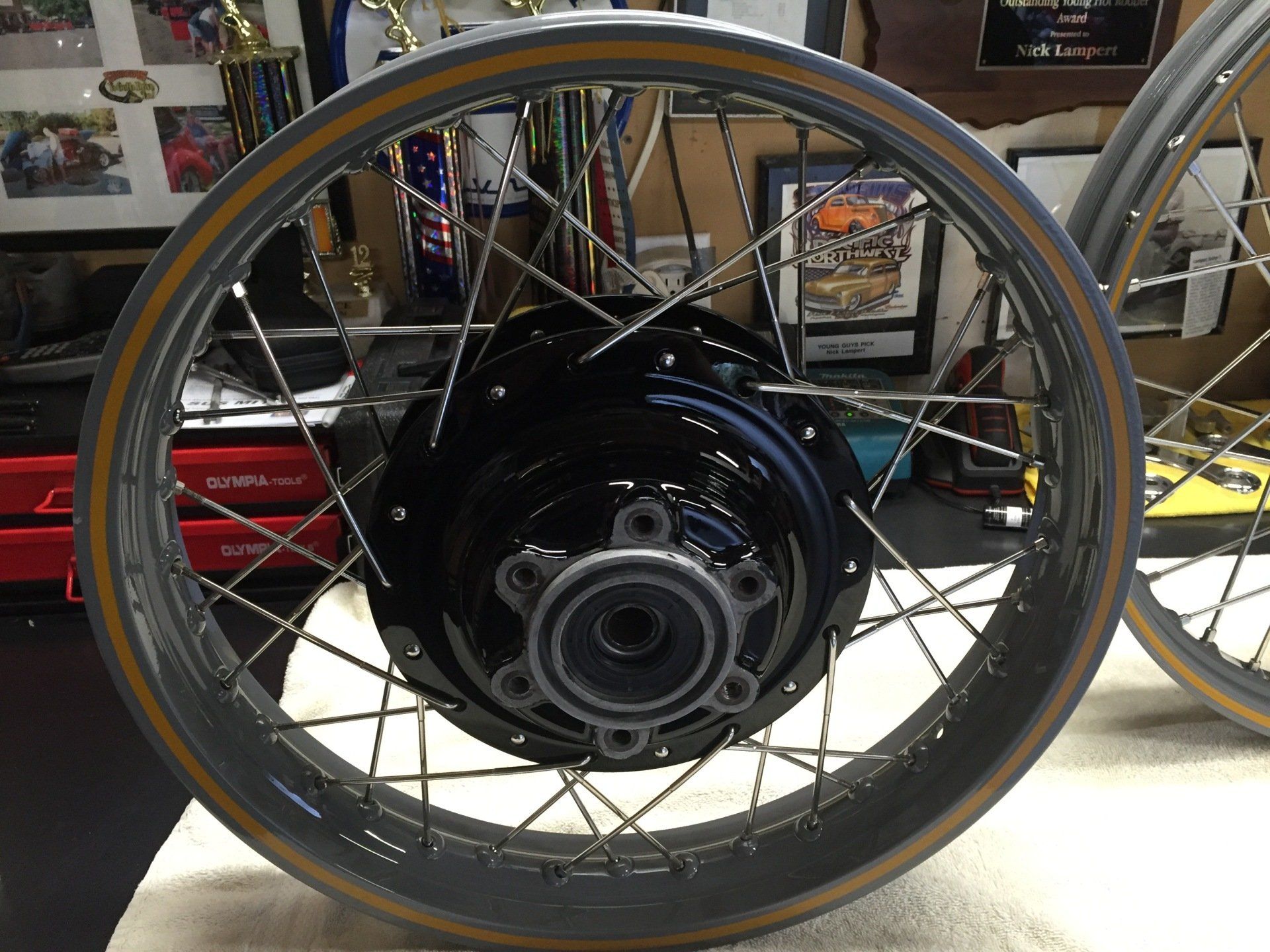 A close up of a motorcycle wheel on a table