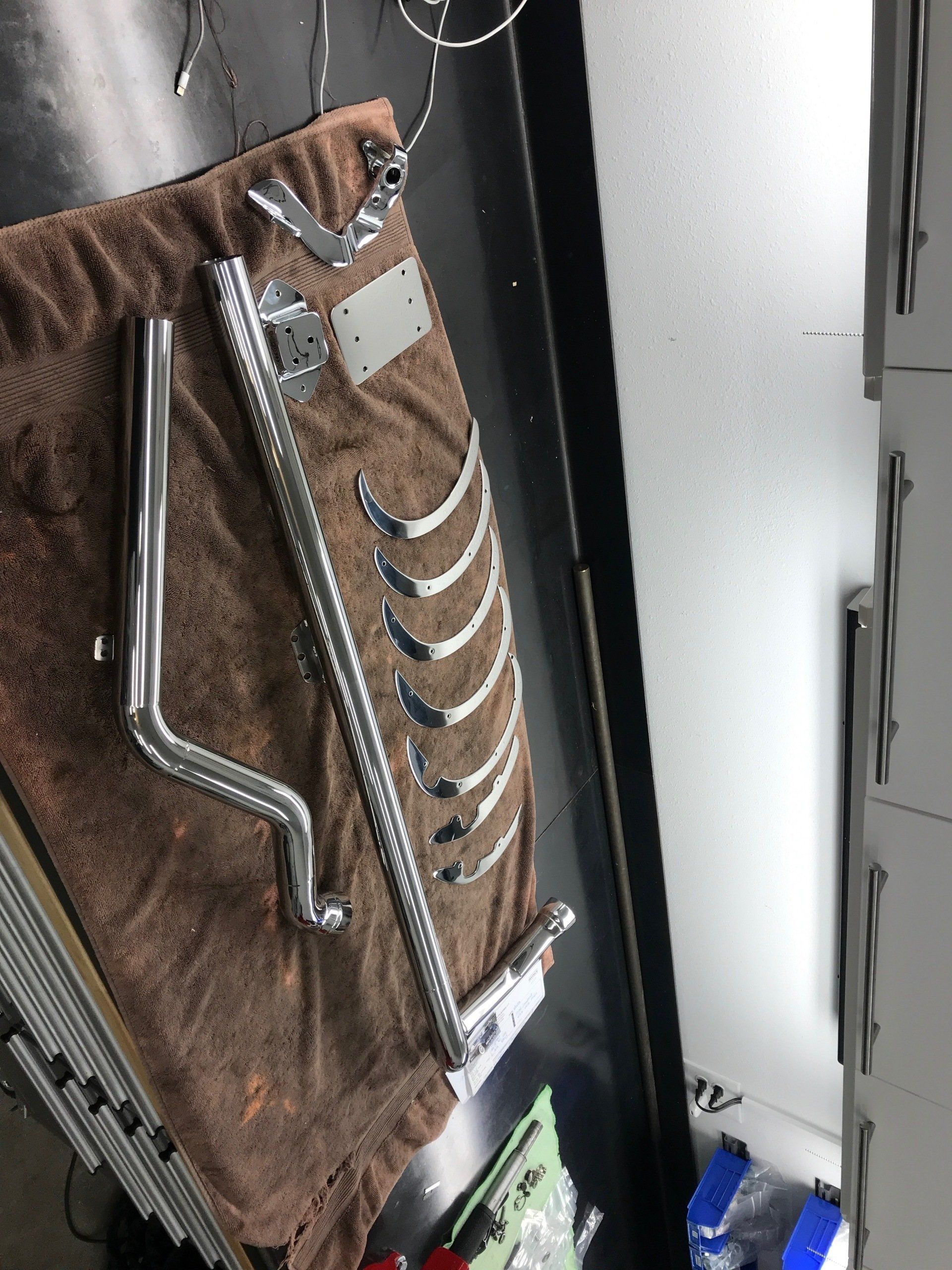 A piece of metal is laying on a brown towel