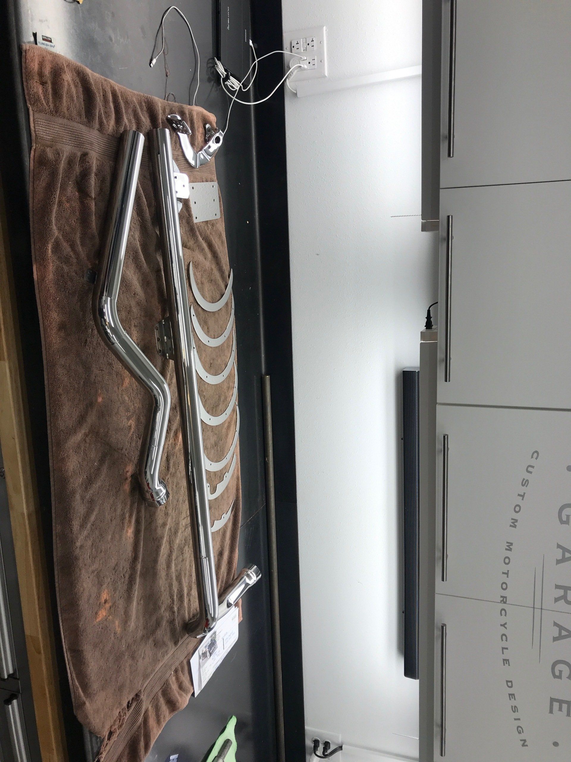 A skeleton is laying on a towel in a kitchen