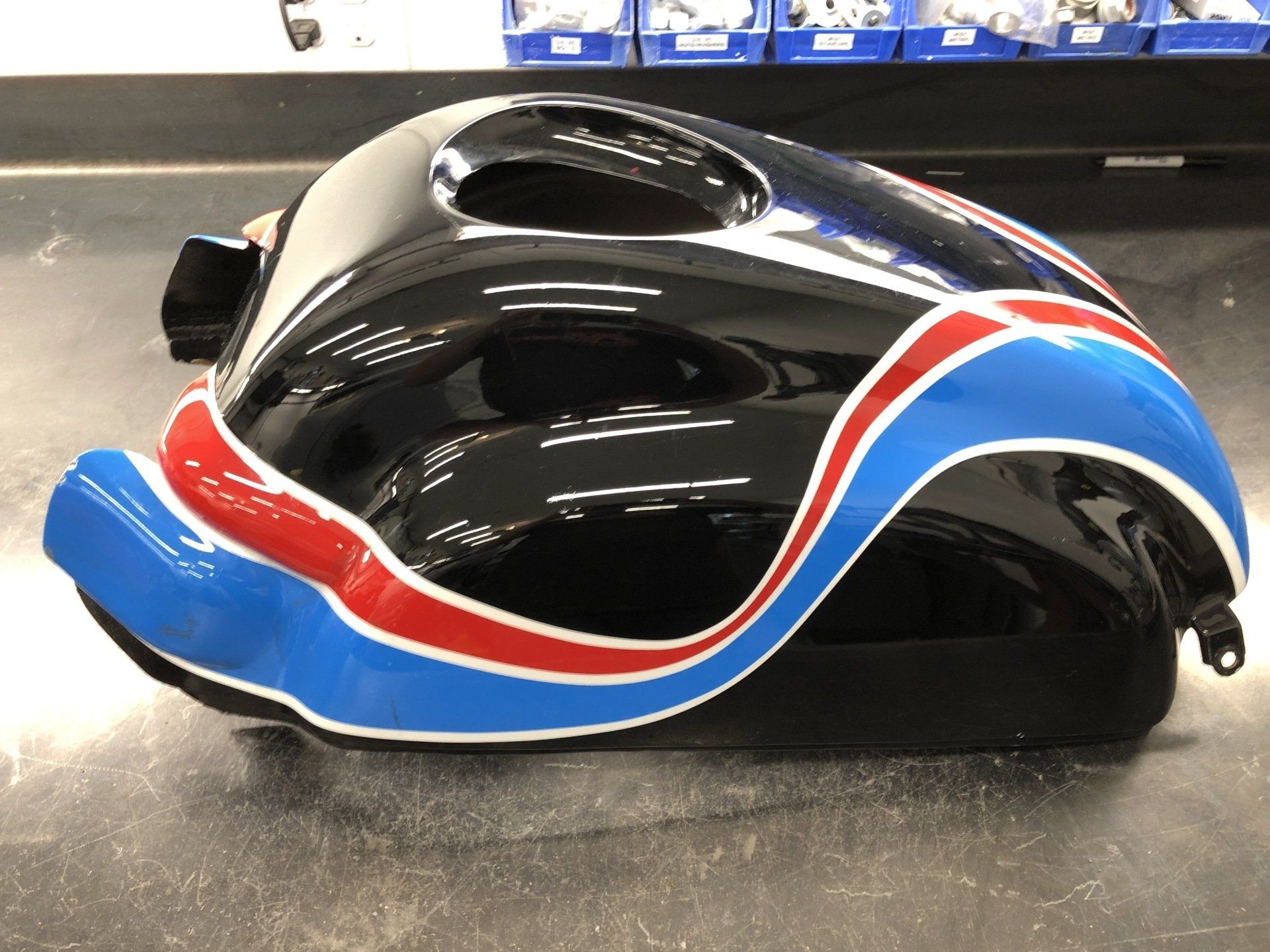A black helmet with red white and blue stripes on it