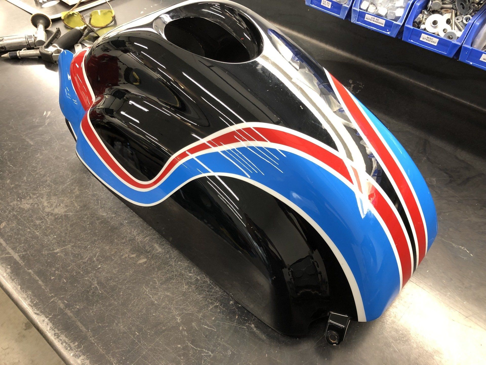 A black helmet with red white and blue stripes on it