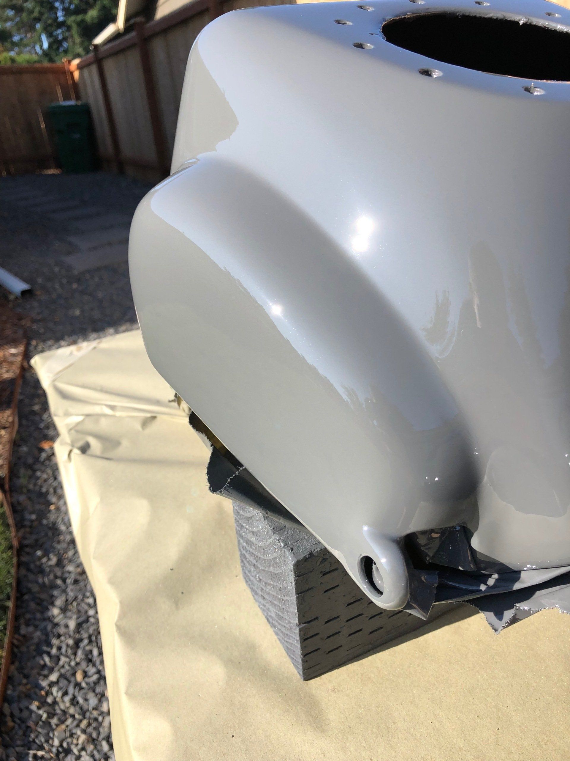 A white object is sitting on a table outside