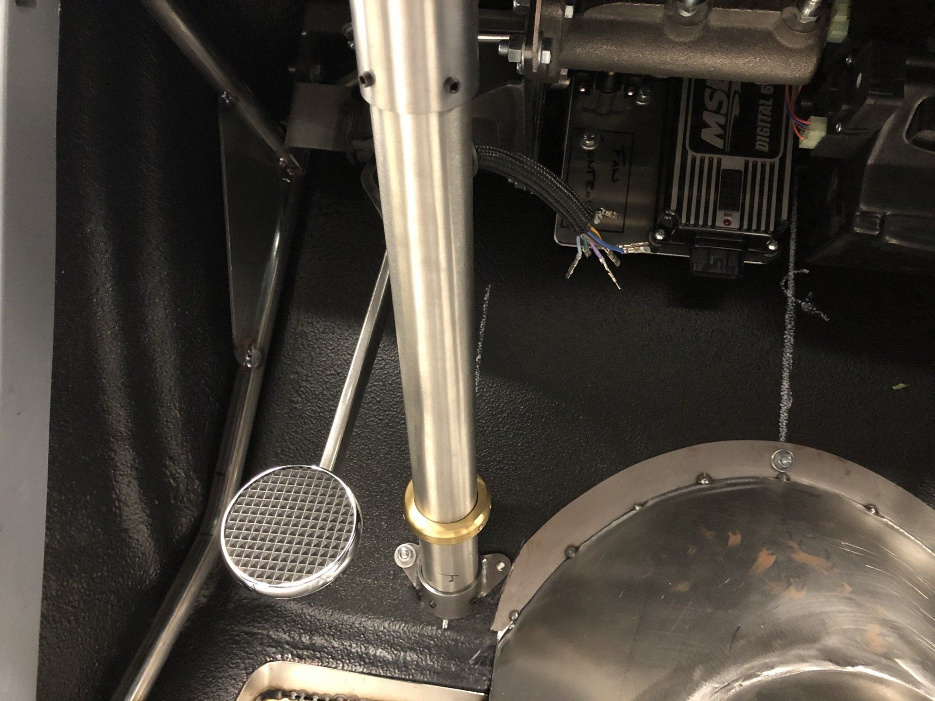 A close up of a brake pedal in a car