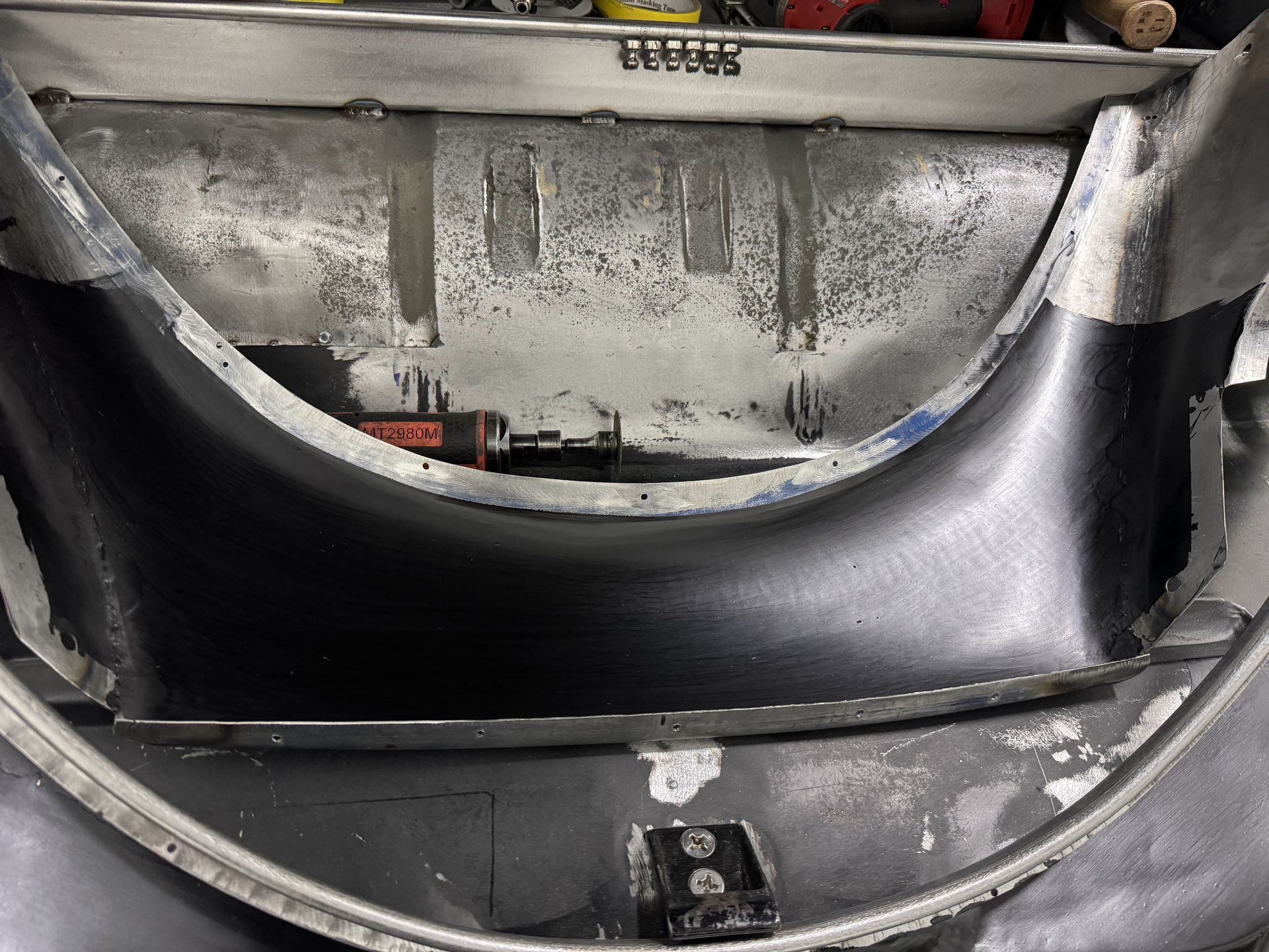 A close up of the back of a car with the hood open