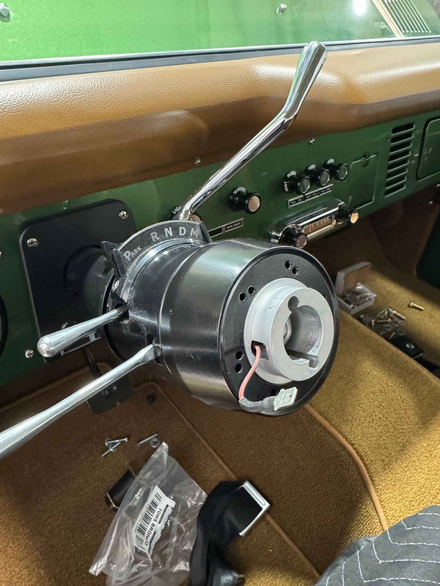 A close up of a steering wheel in a car