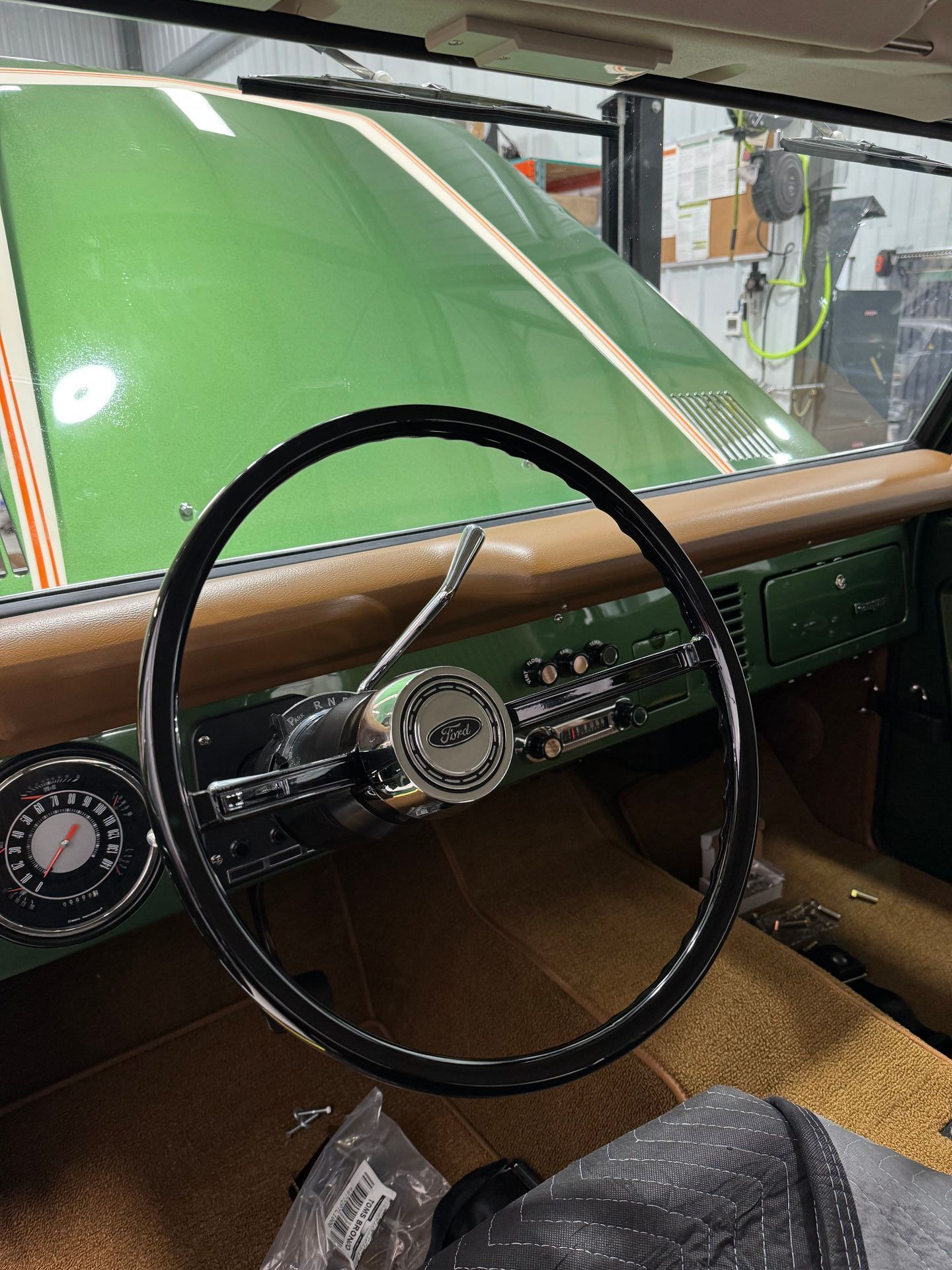 A close up of a steering wheel in a car