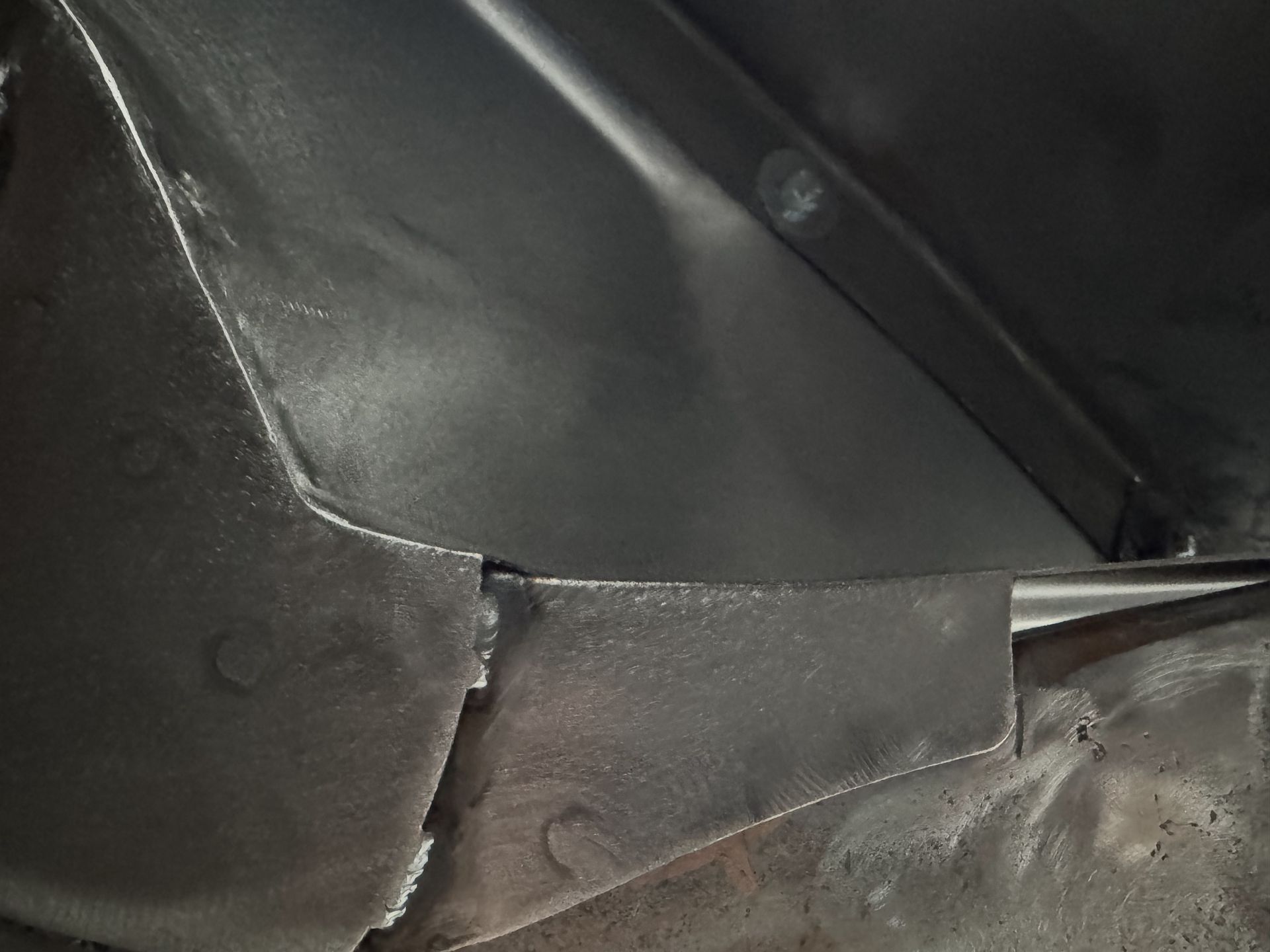 A close up of a piece of metal with a hole in it