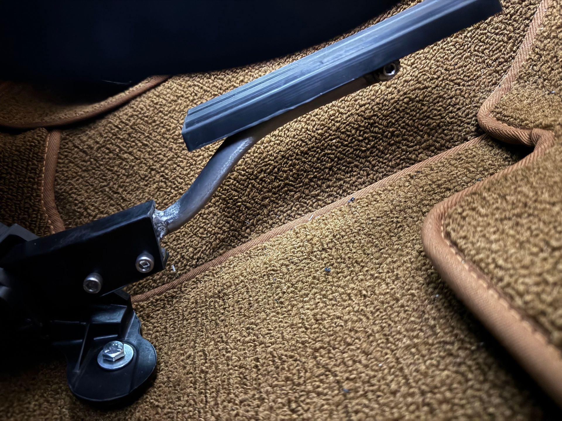 A close up of a brake pedal in a car