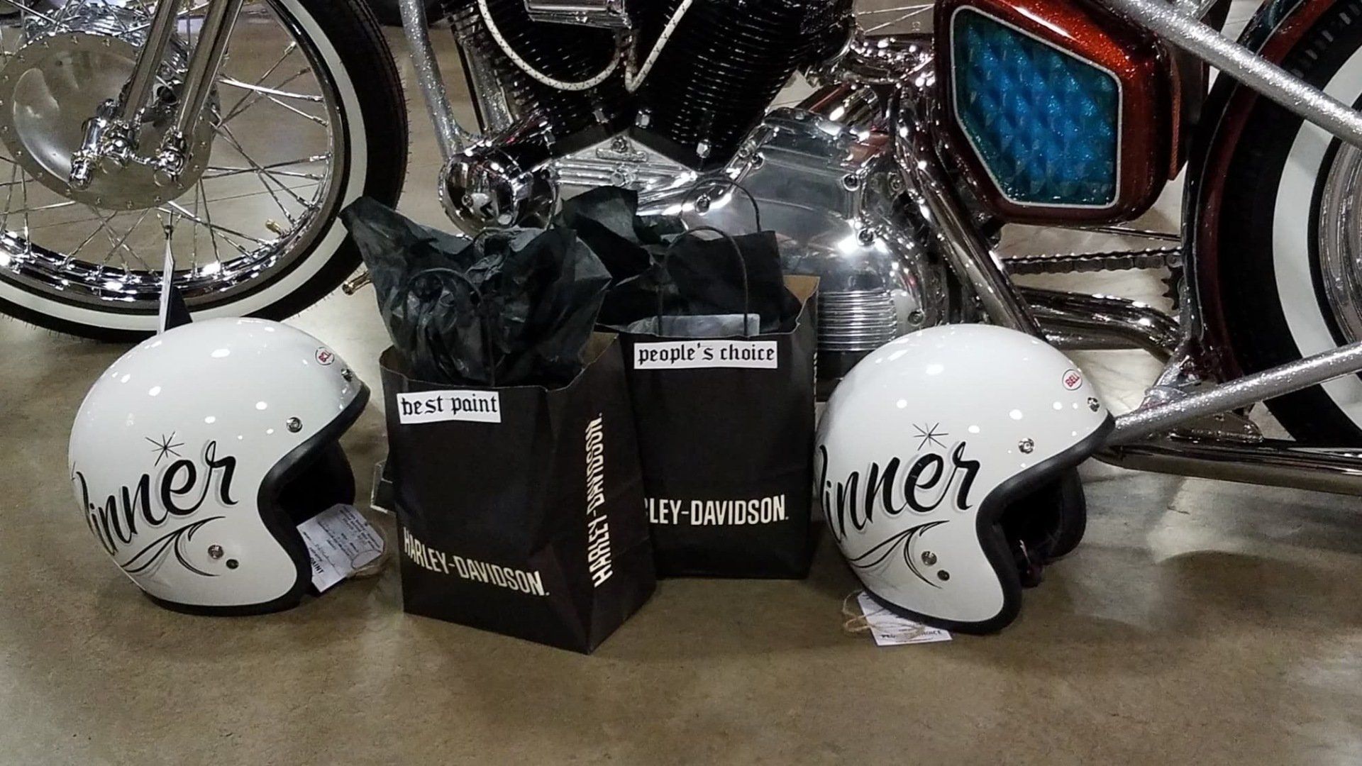 A couple of helmets with the word biker on them