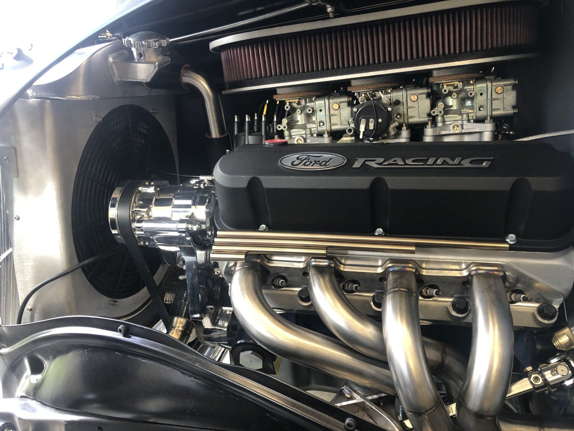 A close up of a ford racing engine in a car
