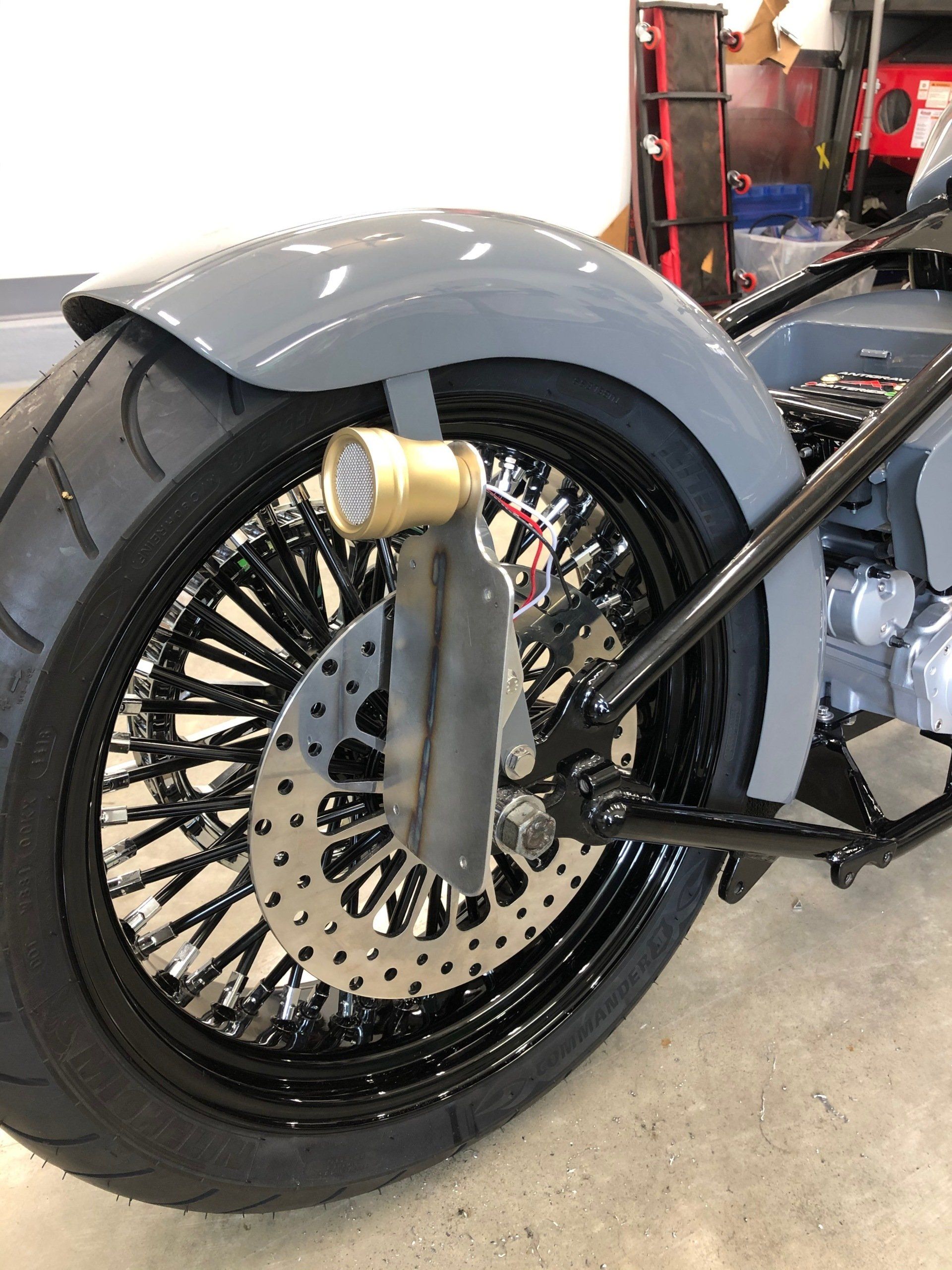 A close up of the rear wheel of a motorcycle