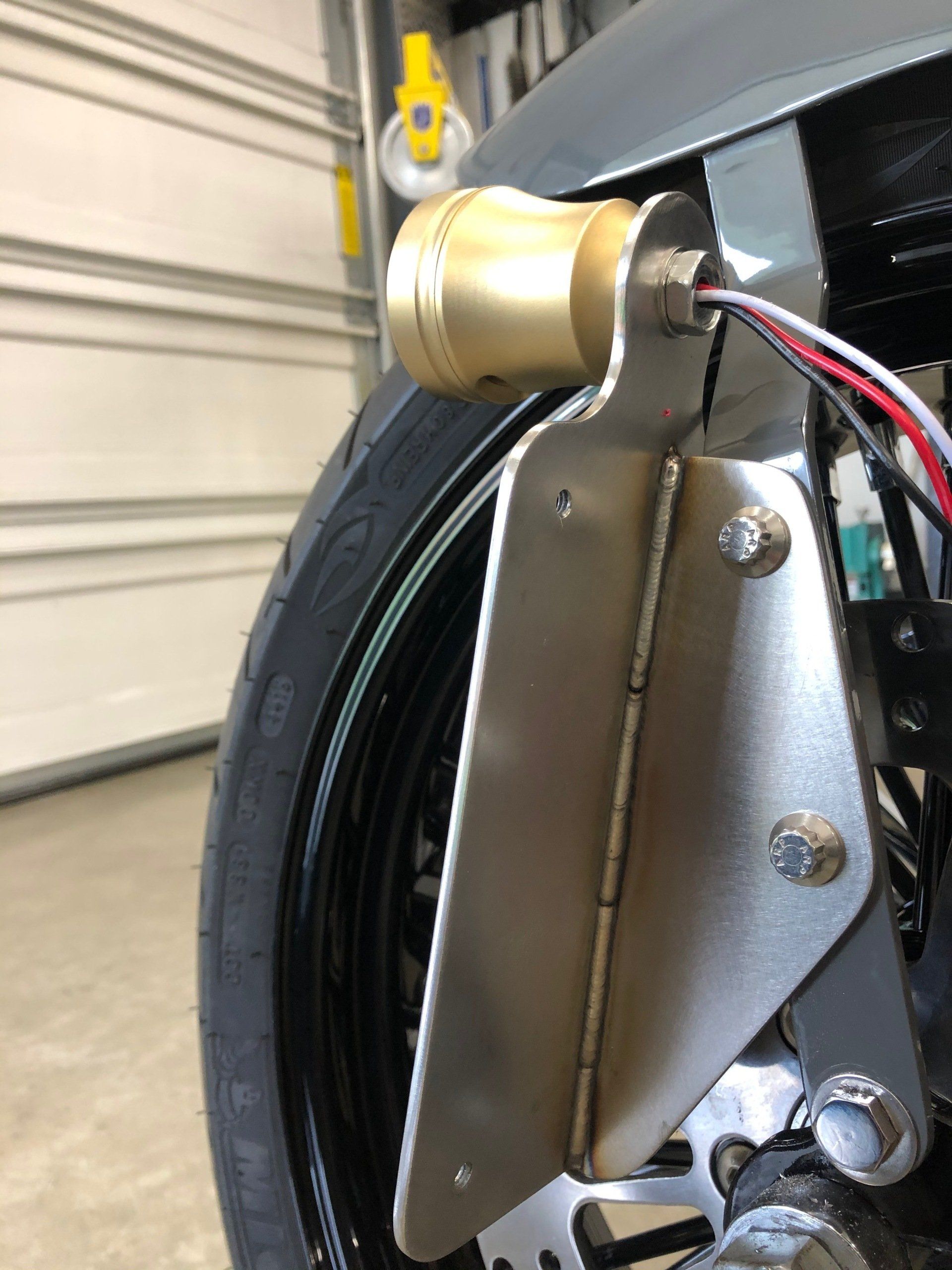 A close up of a license plate holder on a motorcycle.