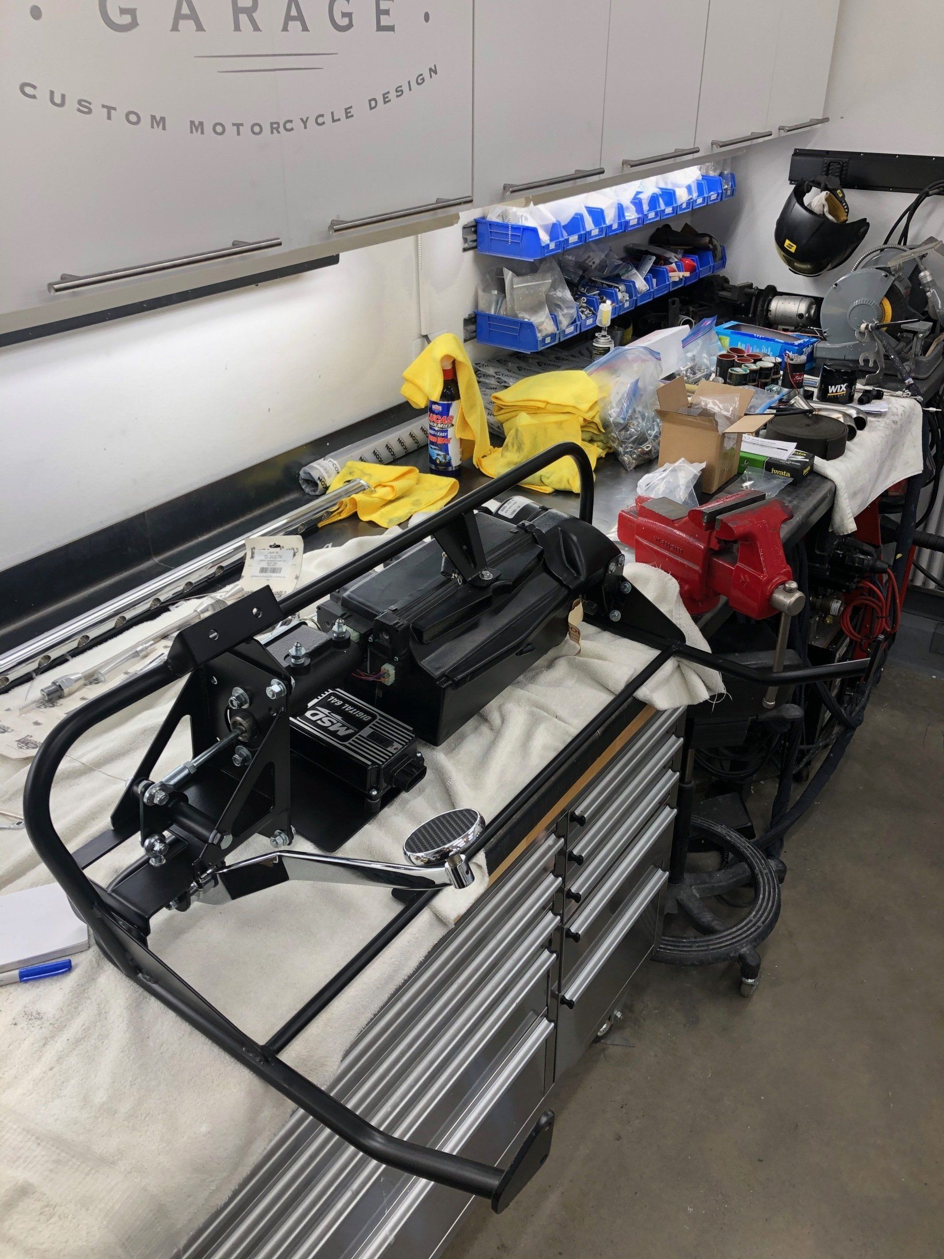A motorcycle is being worked on in a garage
