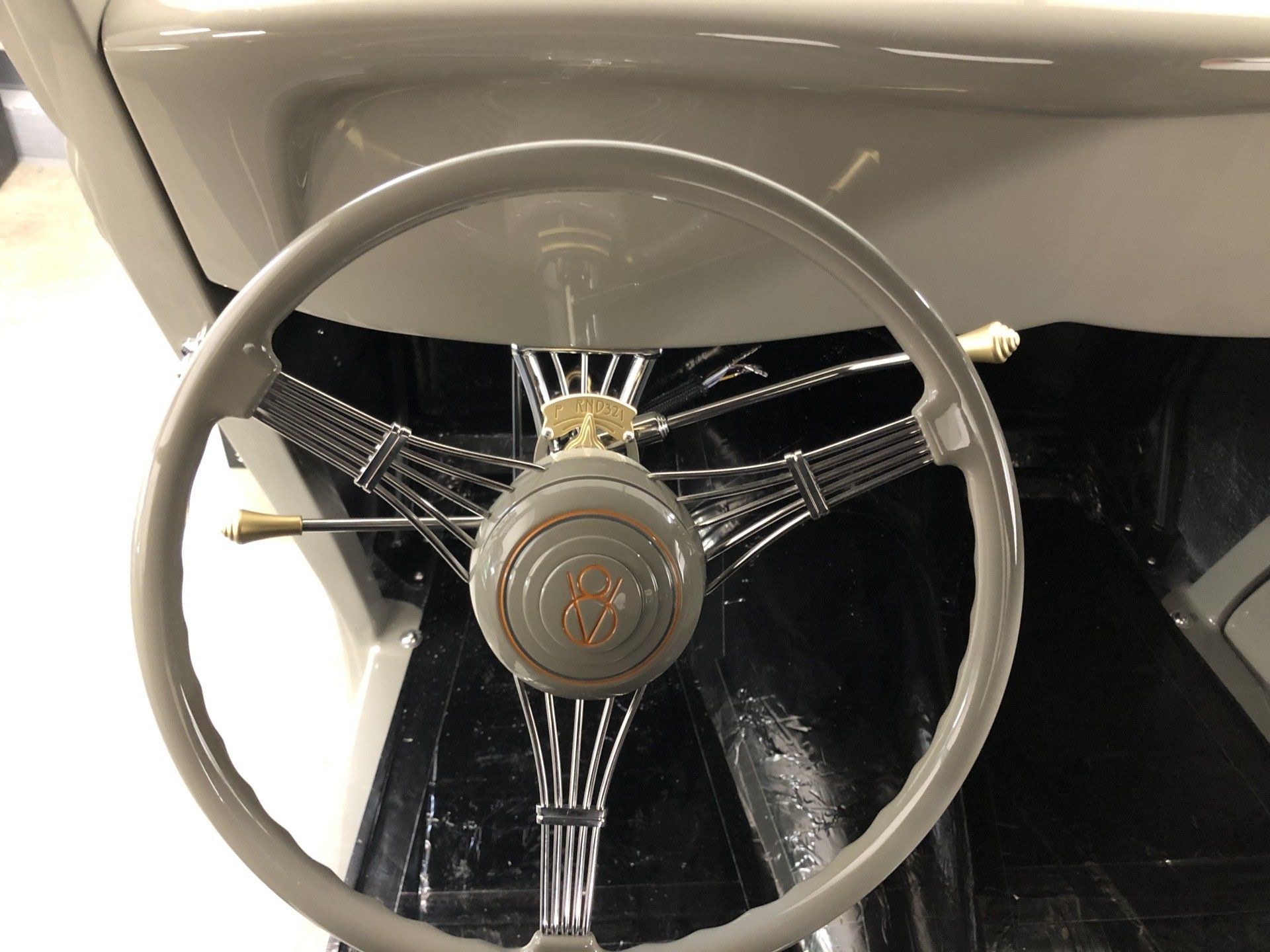 A close up of a steering wheel in a car